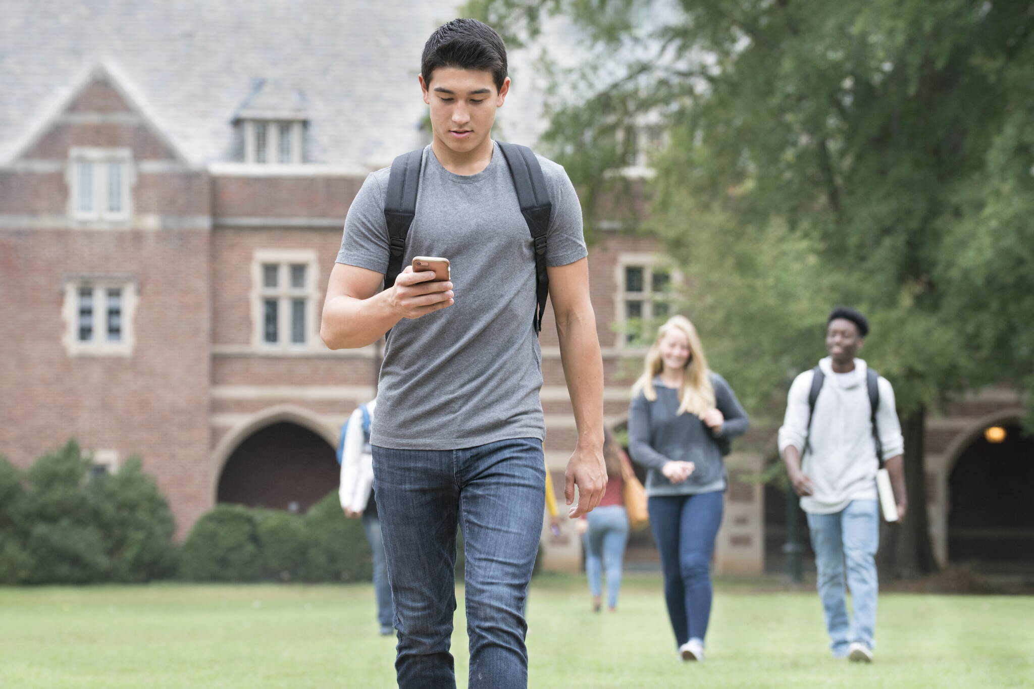 A student texts on a cellphone in this stock photo. (Ariel Skelley/Getty Images)