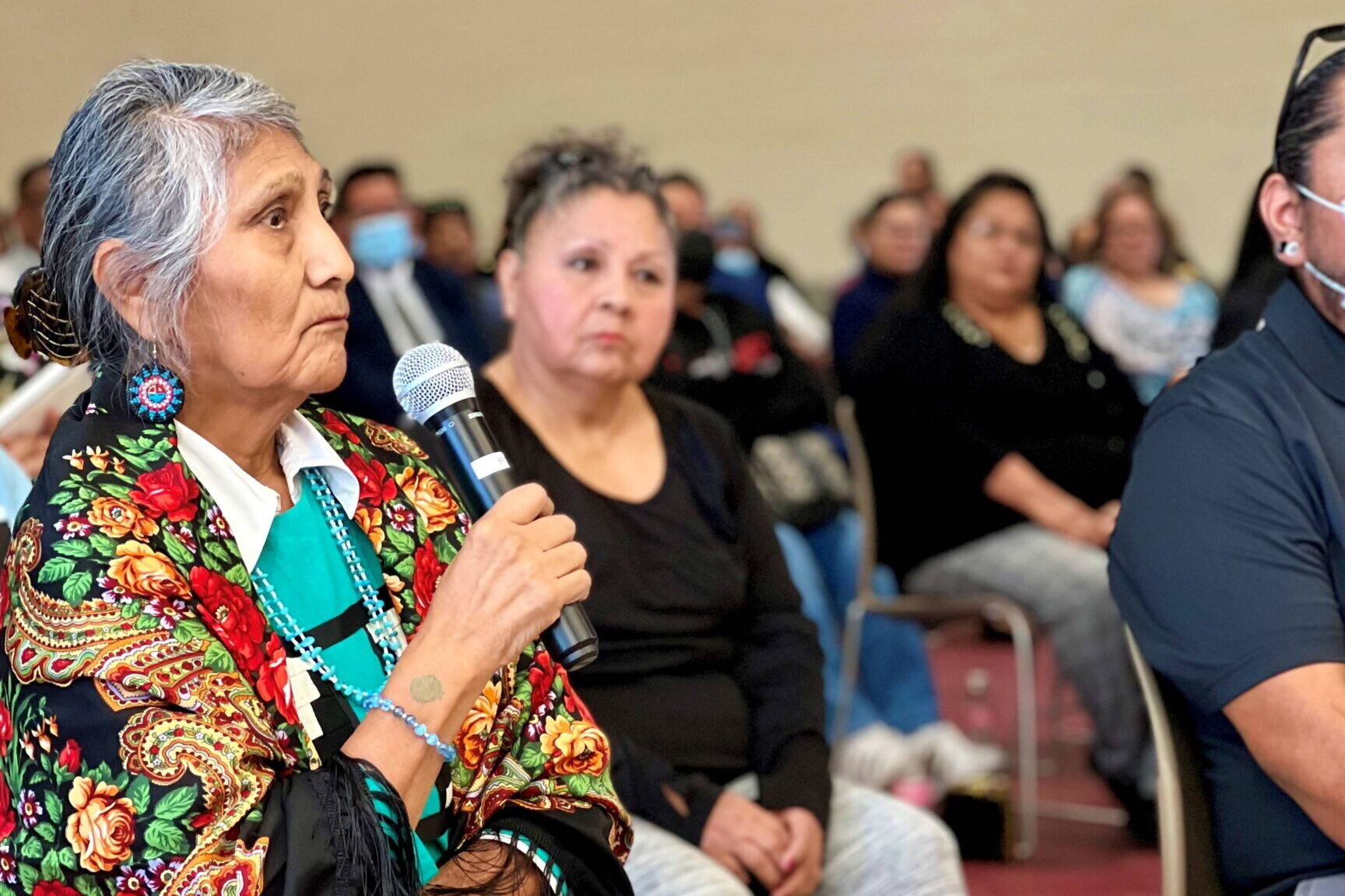 Pershlie Ami, a citizen of the Hopi tribe, shares her experience of attending Phoenix Indian School when she was a kid during the Road to Healing tour hosted by the U.S. Department of Interior at the Gila Crossing Community School on Jan. 20, 2023. (Shondiin Silversmith/Arizona Mirror)