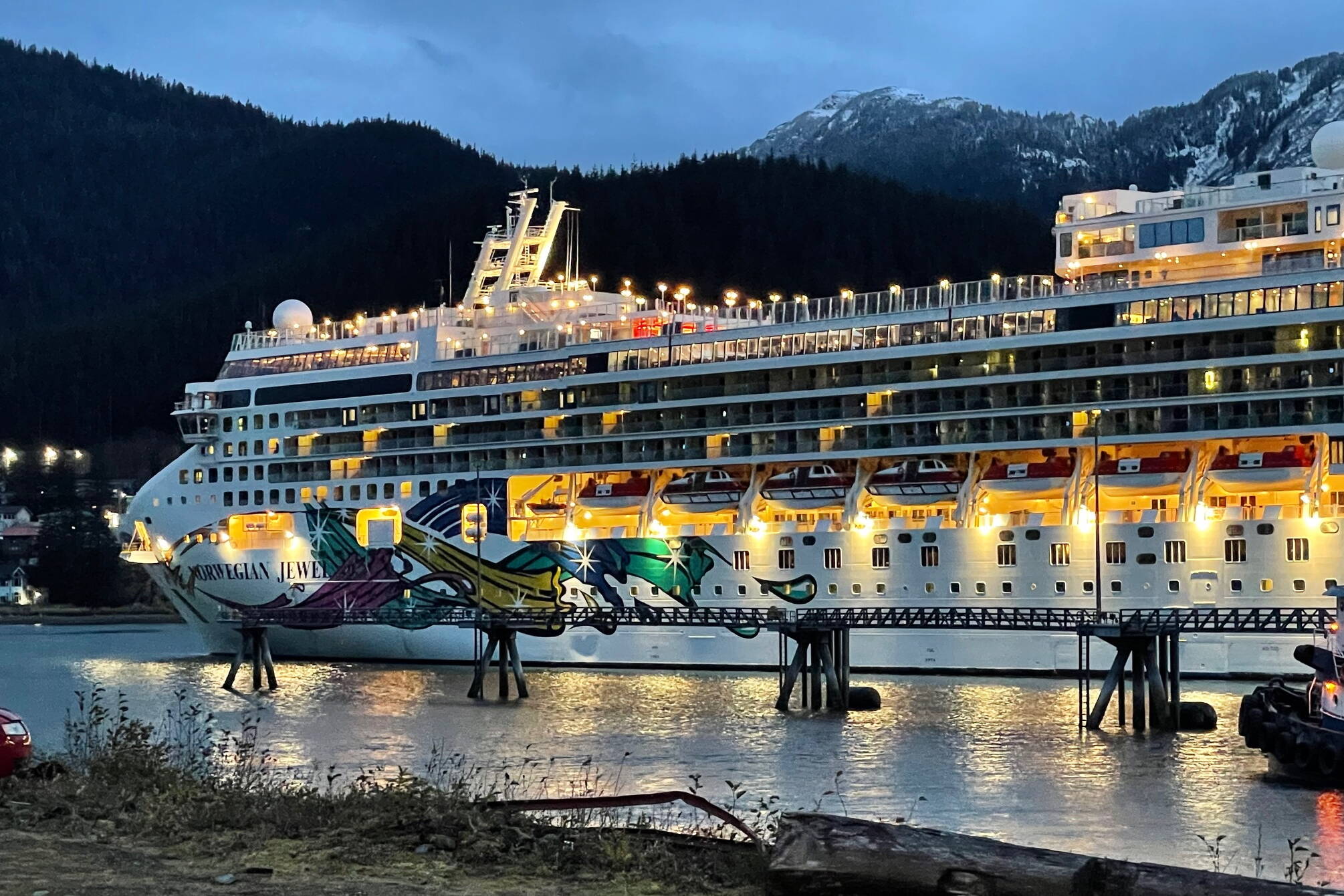 The Norwegian Jewel begins its departure from Juneau on Thursday evening, marking the official end of the 2024 cruise ship season. (Laurie Craig / Juneau Empire)