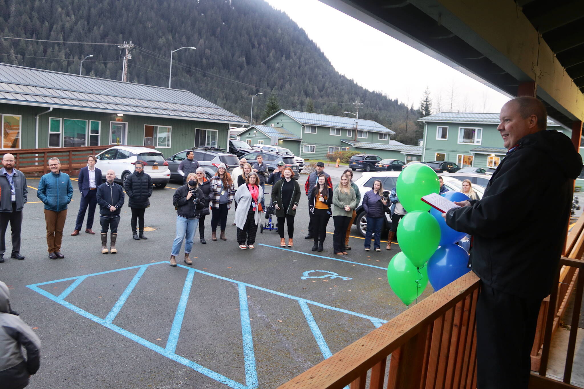 Jonathan Swinton, executive director of Gastineau Human Services, presides over a ribbon-cutting ceremony for the opening of a remodeled behavioral health clinic at the nonprofit organization’s Lemon Creek campus on Thursday. (Mark Sabbatini / Juneau Empire)