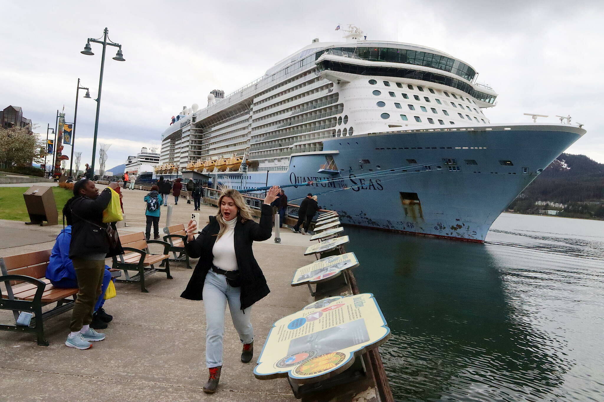 Jasmine Chavez, a crew member aboard the Quantum of the Seas cruise ship, waves to her family during a cell phone conversation after disembarking from the ship at Marine Park on May 10, 2024. (Mark Sabbatini / Juneau Empire file photo)