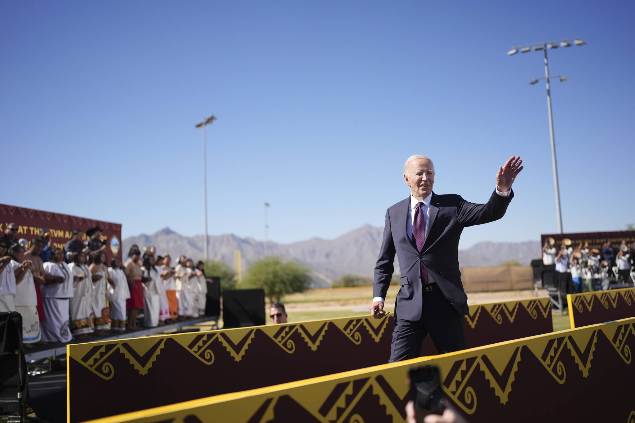 President Joe Biden waves after delivering remarks on the federal government’s role in running boarding schools for Native American children at the Gila Crossing Community School in Gila River Indian Community near Phoenix, Ariz., Oct. 25, 2024. Biden on Friday formally apologized for the role of the federal government in running boarding schools where thousands of Native American children faced abuse, neglect and the erasure of their tribal identities. (Eric Lee/The New York Times)