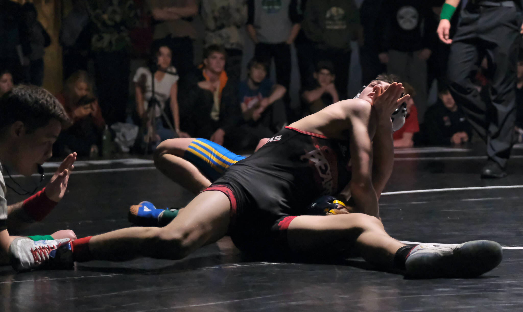 Juneau-Douglas High School: Yadaa.at Kalé sophomore Camden Messmer pins Skagway junior Brenden Moncibaiz in their 119-pound title match on Saturday at the Southeast Showdown Wrestling Tournament in Juneau’s George Houston Gymnasium. (Klas Stolpe / Juneau Empire)