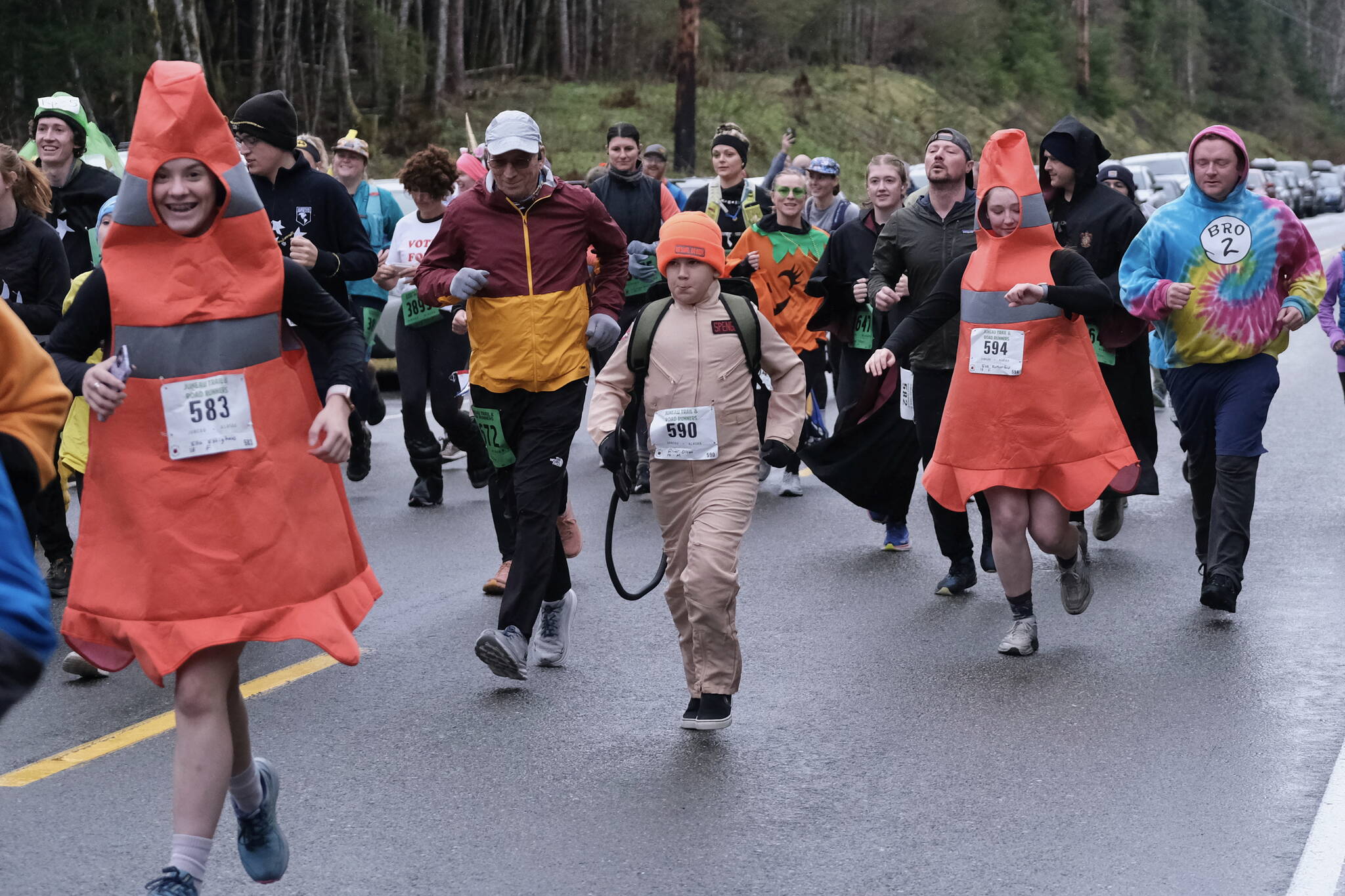 Participants race in the Halloween Half Marathon and 5K on Saturday along North Douglas Highway. (Klas Stolpe / Juneau Empire)