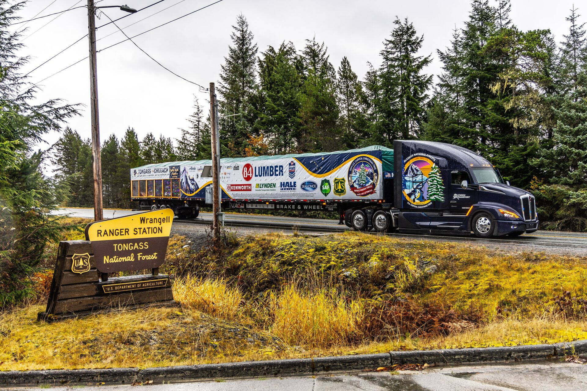 A truck carries the 2024 U.S. Capitol Christmas Tree from a forest in Wrangell to the town’s Alaska Marine High Ferry Terminal in preparation for the tree’s journey to Washington, D.C. (James Edward Mills / U.S. Forest Service)