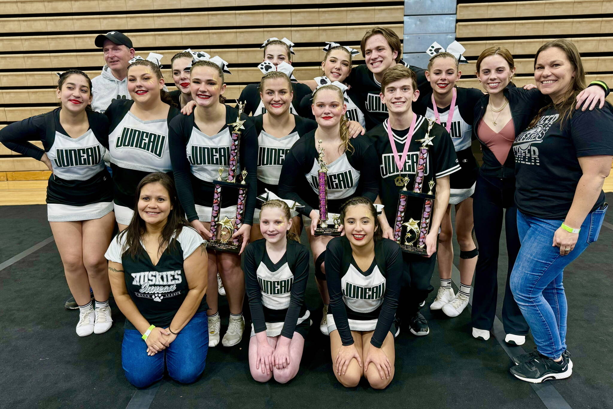 The Juneau Huskies competition cheer team pose for a photo at last weekend’s 2024 Rally in the Valley Cheer Competition at Palmer’s Colony High School. Back row left to right: Assistant coach Rob Day, Savannah Cornett Markey, Avery Cornett Markey, Marzena Whitmore, Kajson Cunningham, Gracie Kohuth, assistant coach Katelyn Kohuth and head coach Stephany Day. Middle row l-r: Faith Montez, Rylie Mulkey, Ayla Keller, Tenlee Roemer, Samantha Day and Elijah Levy. Front row l-r: Assistant coach Vanessa Aube, Rory Love and Viviana Flores. (Photo courtesy Samantha Day).