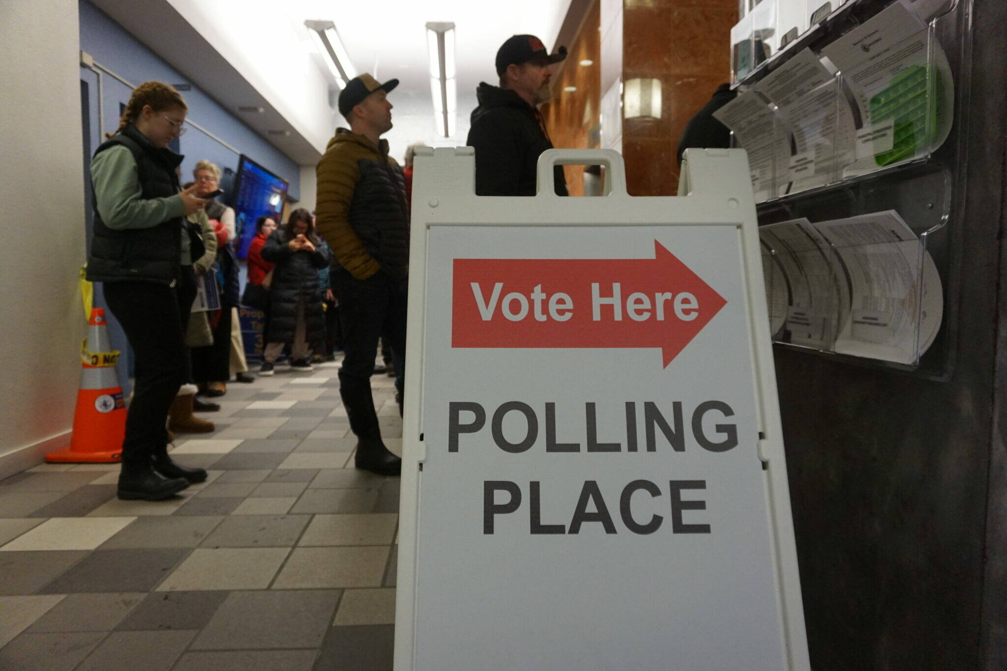 Voters at Anchorage City Hall wait in line to cast their ballots on Monday, the day before Election Day. City hall, in downtown Anchorage, was one of the designated early voting sites in the state’s largest city; however, it is not an Election Day polling site. (Yereth Rosen/Alaska Beacon)