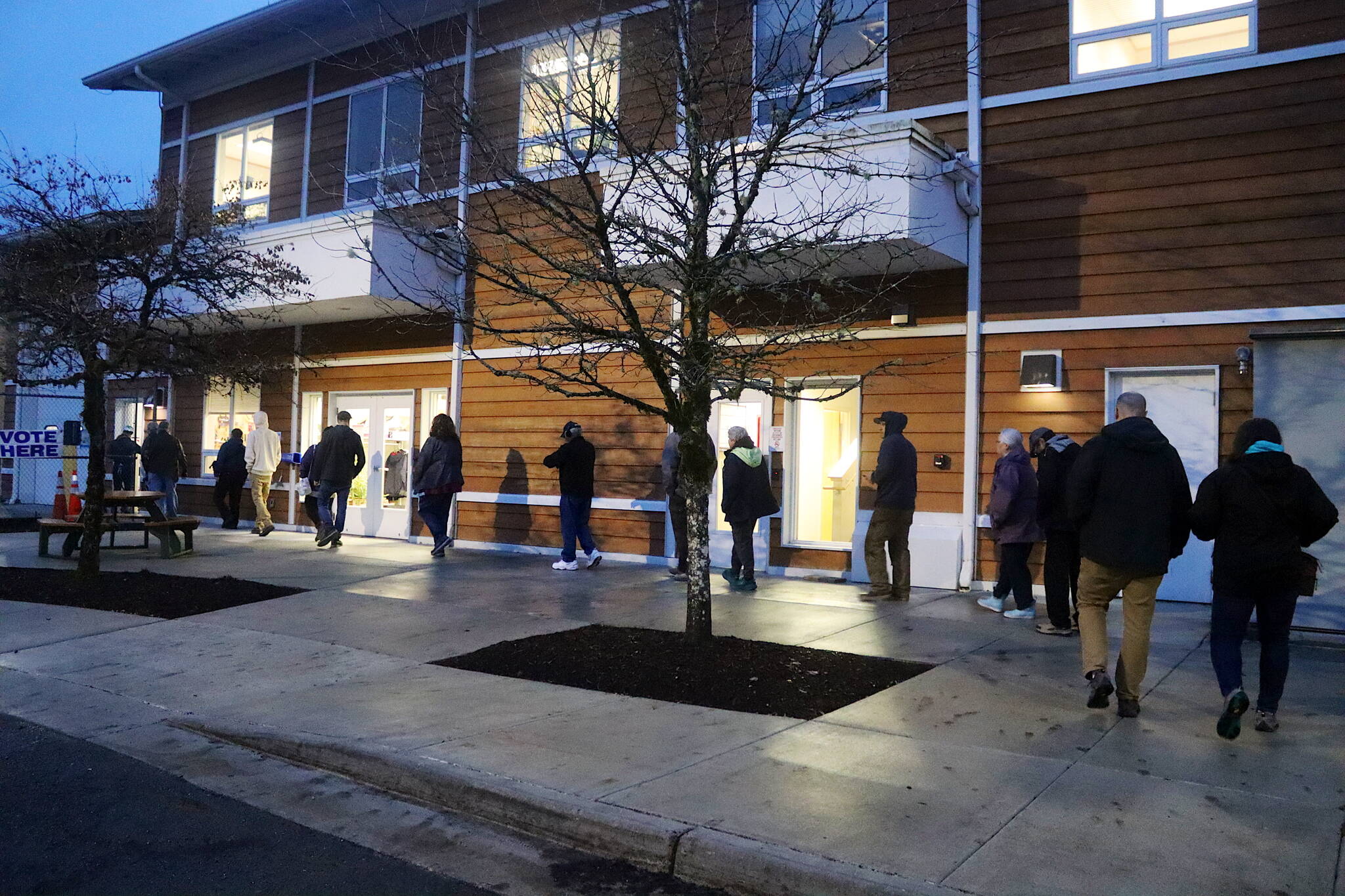 Lemon Creek voters enter the Alaska Electric Light Power building as polls open at 7 a.m. on Tuesday. (Mark Sabbatini / Juneau Empire)