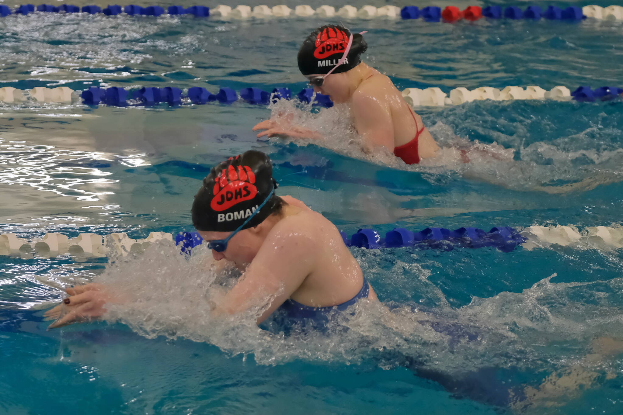 Juneau-Douglas High School: Yadaa.at Kalé senior Parker Boman and sophomore Kennedy Miller swim the 100 breaststroke final at the Region V Championships last weekend in the Petersburg Aquatic Center. (Klas Stolpe / Juneau Empire)