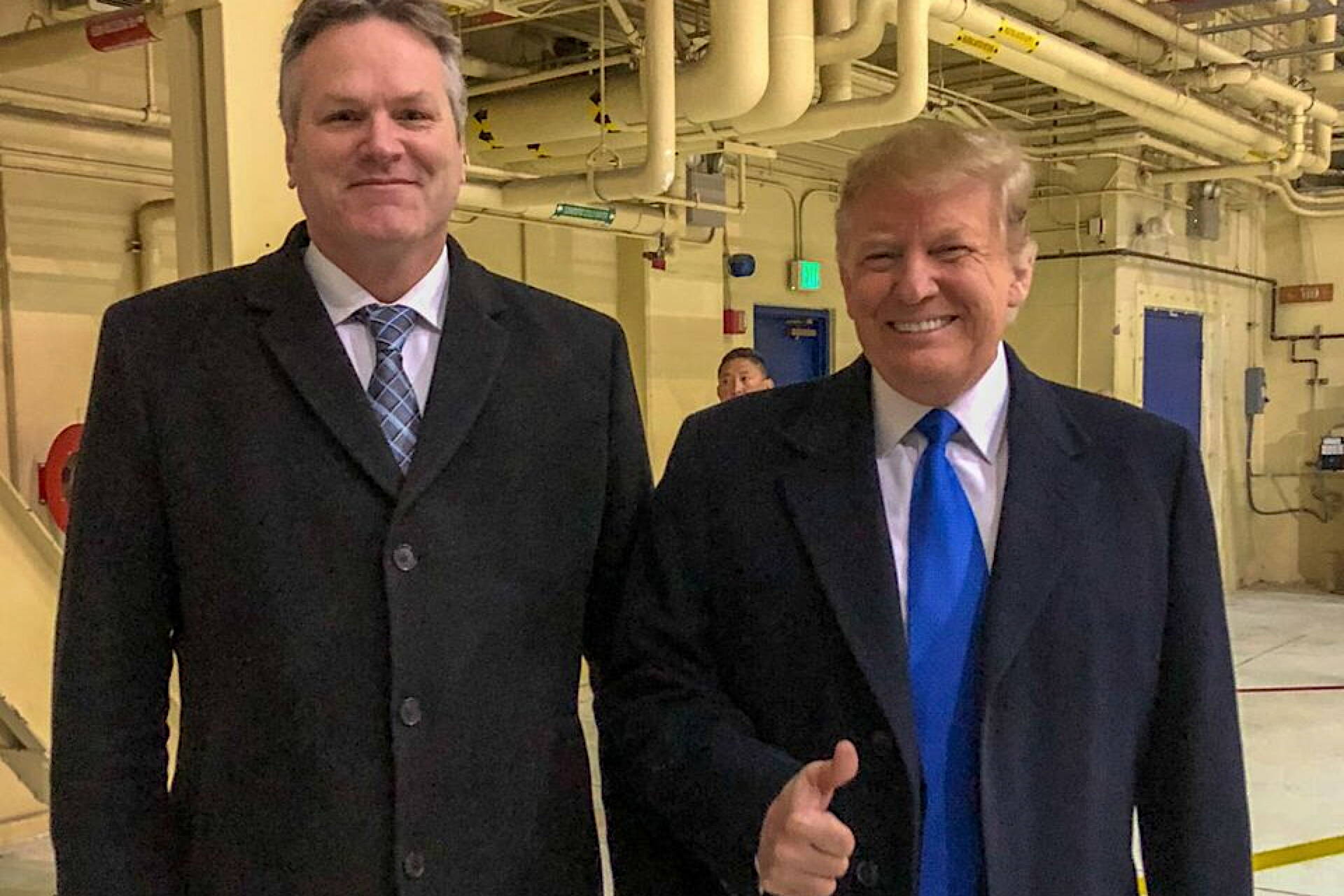 Gov. Mike Dunleavy poses with then-President Donald Trump during a refueling stop by Air Force One at Joint Base Elmendorf-Richardson in February of 2019. (Official White House photo)