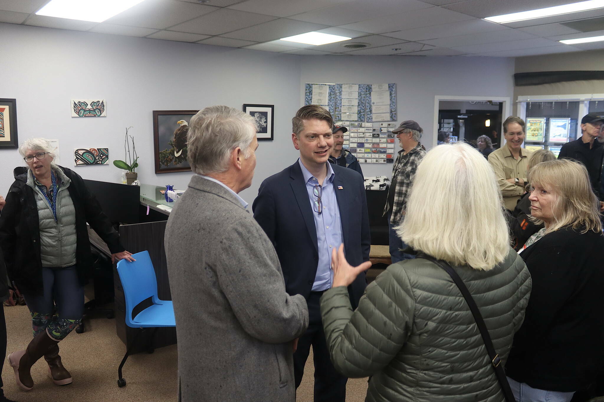 Nick Begich, center, the Republican candidate for Alaska’s lone U.S. House seat, talks with supporters during a meet-and-greet Oct. 12 at the Southeast Alaska Real Estate office near the Nugget Mall. (Mark Sabbatini / Juneau Empire file photo)