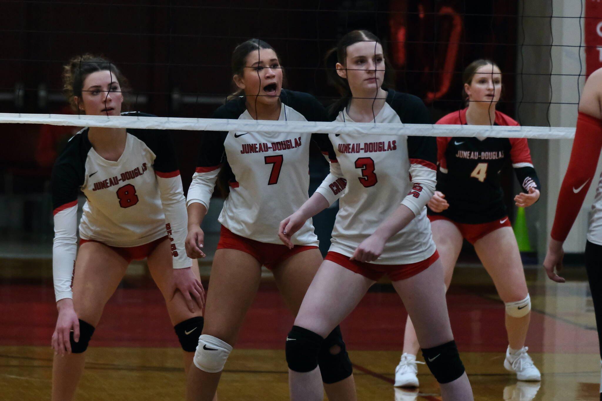 Juneau-Douglas High School: Yadaa.at Kalé senior Evelyn Richards (8), sophomore Leila Cooper (7), senior Tatum Billings (3) and junior Cambry Lockhart (4) await a serve against Wasilla in a game earlier this season at the George Houston Gymnasium. The Crimson Bears season ended with two losses in the state tournament this weekend. (Klas Stolpe / Juneau Empire file photo)