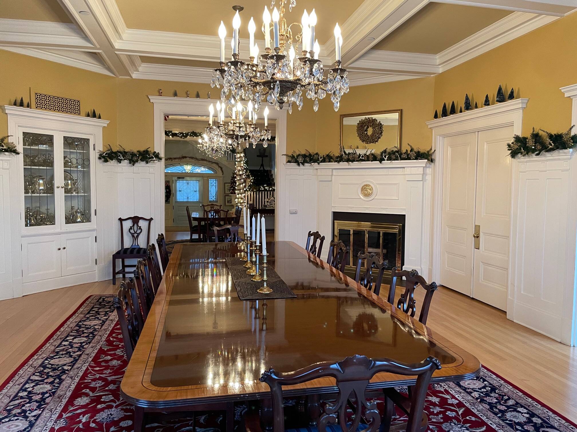 Looking through the dining room and reception area to the front door. The table will be covered with holiday treats during the afternoon open house. The Stickley slide table, when several extensions are added, provides comfortable seating for 22 dinner guests. (Laurie Craig / Juneau Empire)