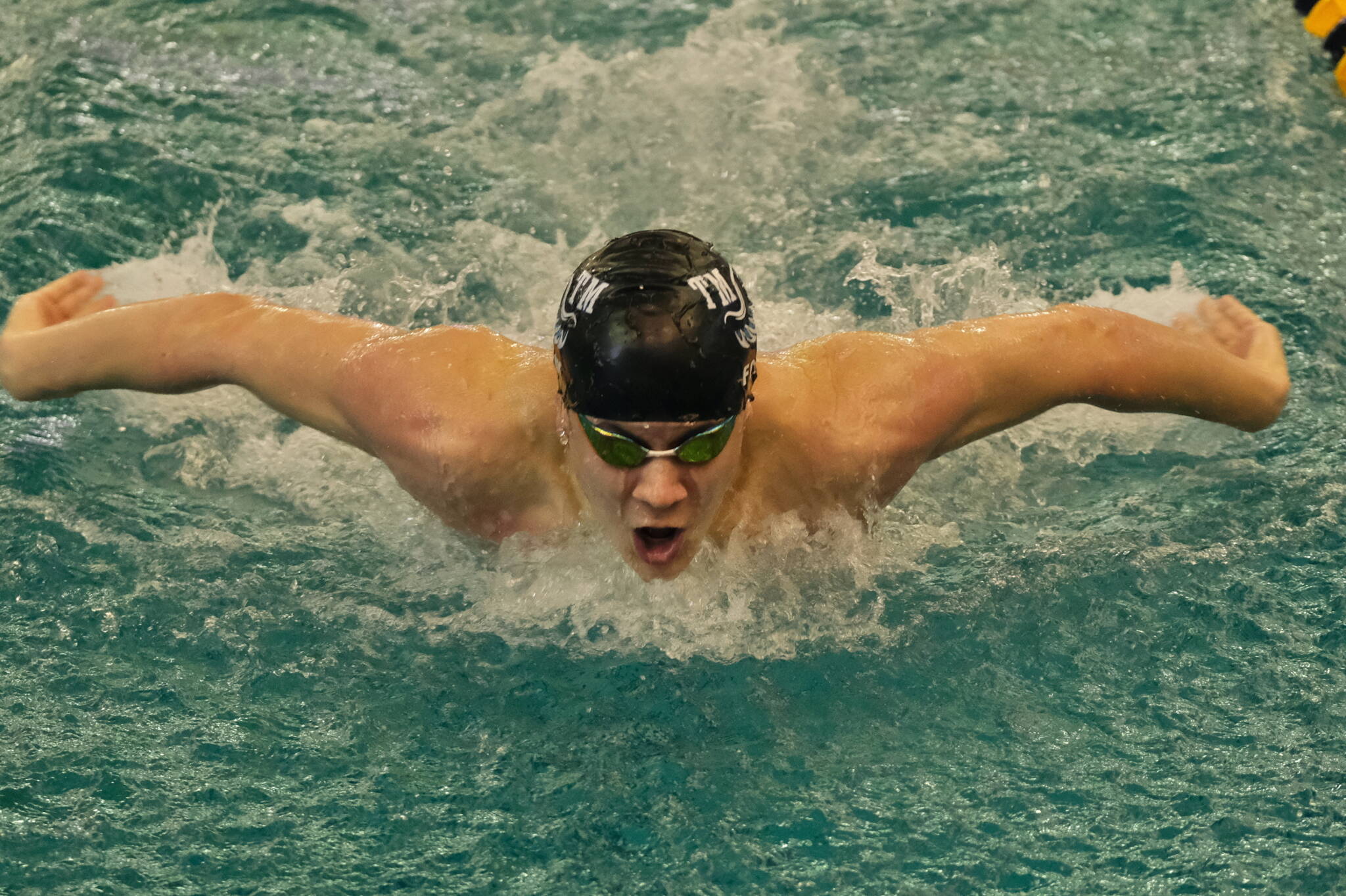 Juneau’s PJ Foy, shown winning the 2023 100-yard butterfly in 48.27 for Thunder Mountain High School during the ASAA state championships at the Dimond Park Aquatics Center on Nov. 4, 2023. (Klas Stolpe / Juneau Empire file photo)