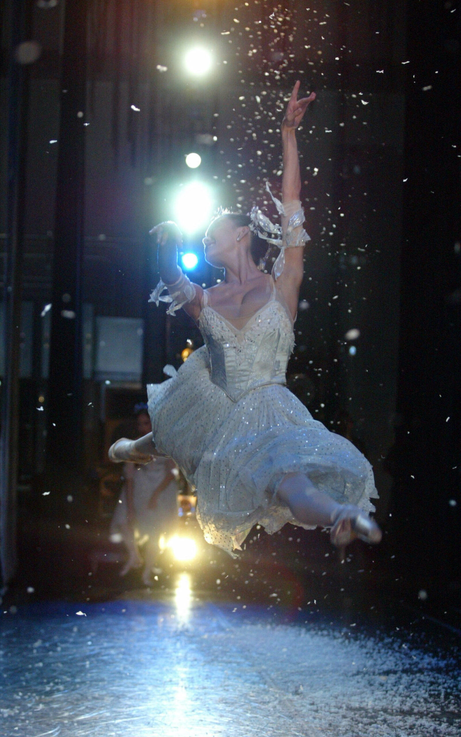 Oregon Ballet Theatre principal dancer Daniela DeLoe performs a grand jete to open the snowflakes dance in the Land Of Snow during a performance of George Balanchine’s “The Nutcracker.” DeLoe, from Las Vegas, Nevada, has been with the OBT company since 2002. (Photo by Klas Stople)