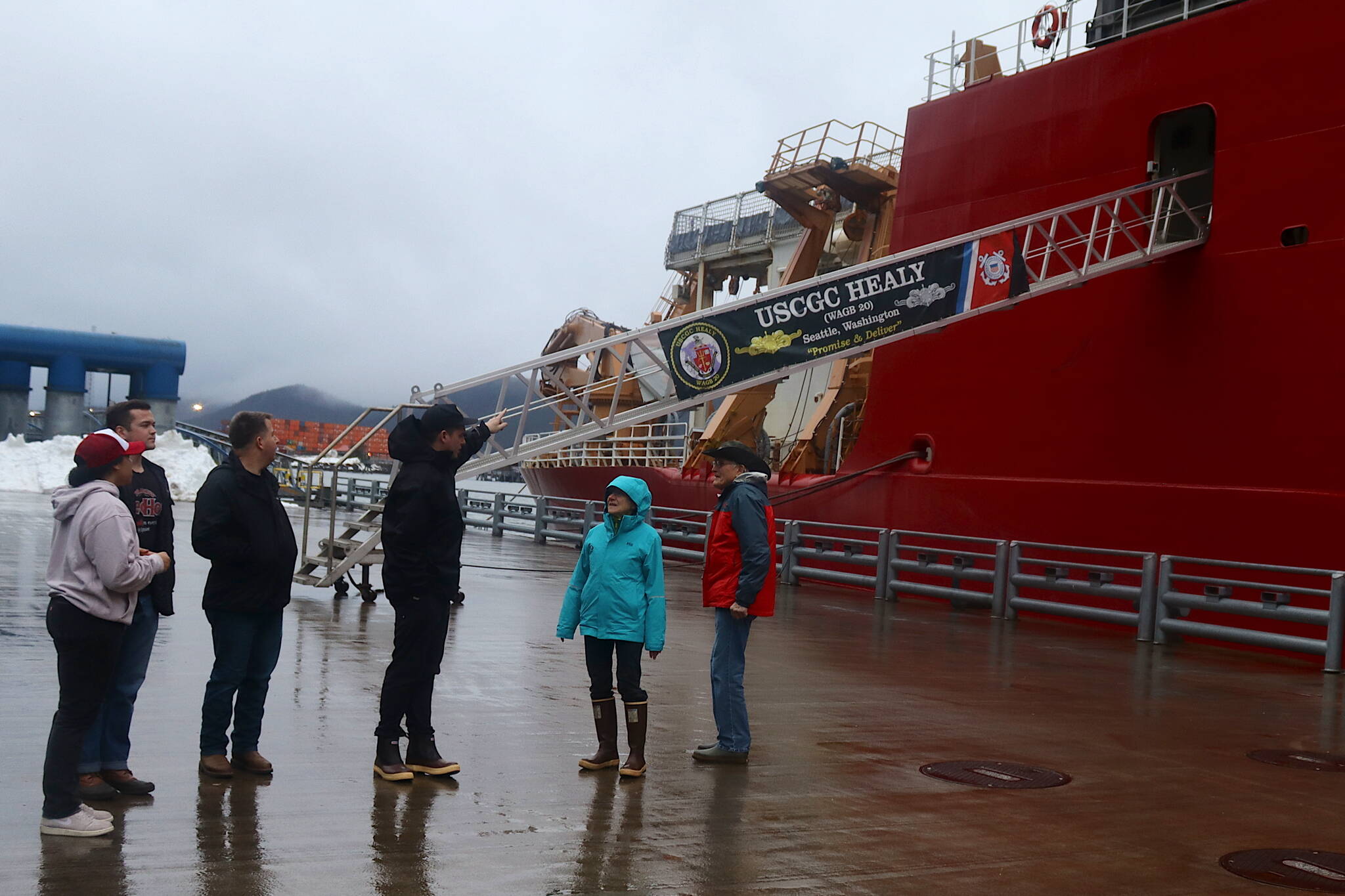 Crew of the U.S. Coast Guard’s Healy icebreaker talk with Juneau residents stopping by to look at the ship on Thursday at the downtown cruise ship dock. Public tours of the vessel are being offered from 3:30-5:30 p.m. Friday. (Mark Sabbatini / Juneau Empire)