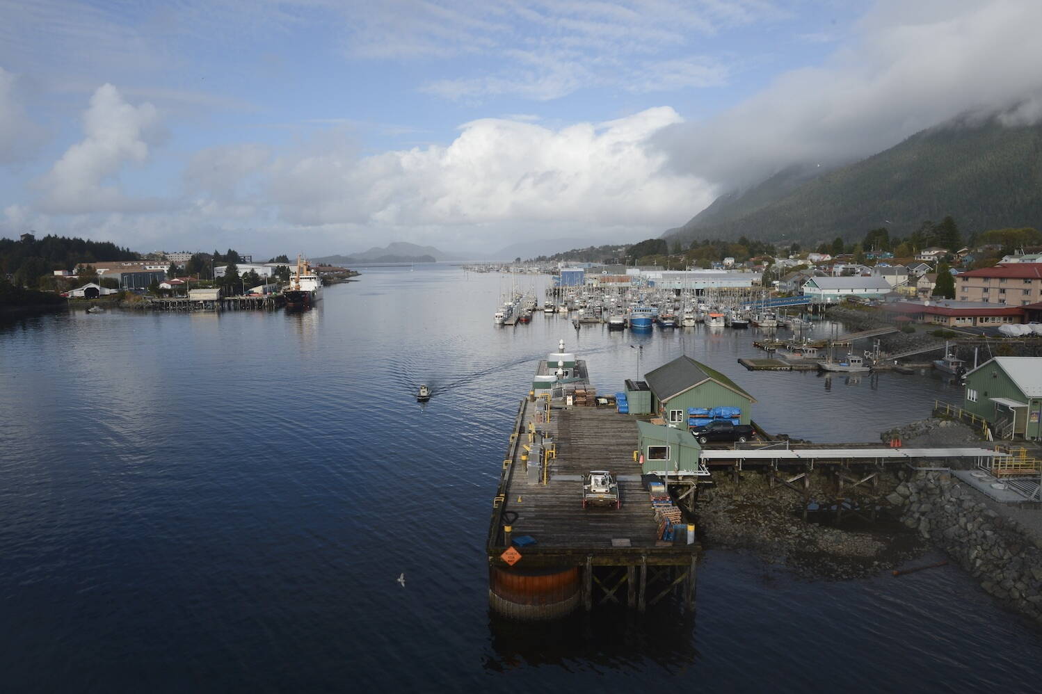 A small boat motors down Sitka Channel in Sitka on Thursday, Oct. 19, 2023. (James Brooks/Alaska Beacon)