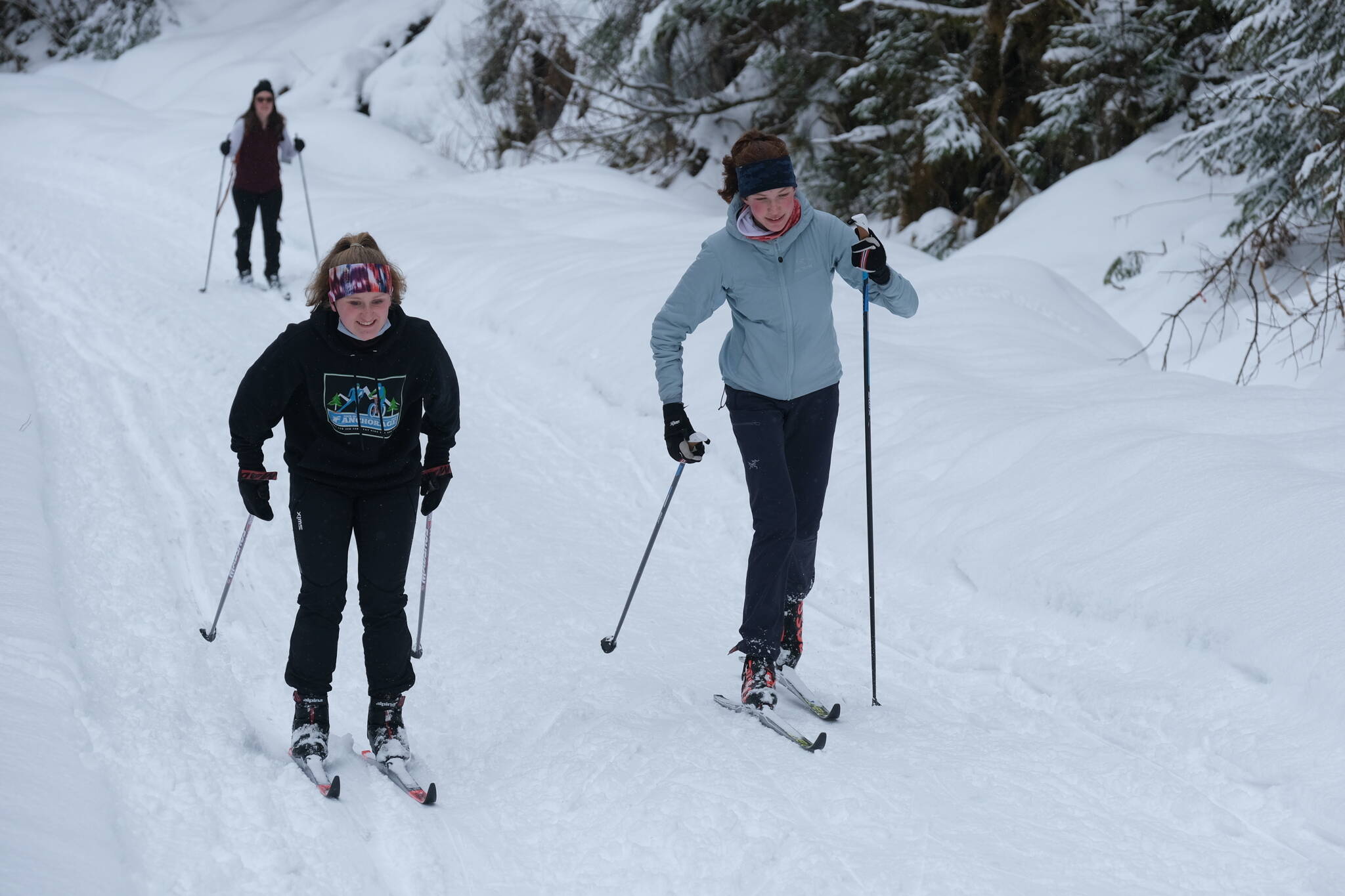 In this 2021 photo Nordic skiers participate in the Border to Border Ski Race along Salmon Creek. The event is modeled after the Rajalta Rajalle-Hiihto race across Finland and included Pioneer Road, Eaglecrest Nordic Lower Loop, Salmon Creek, Montana Creek and the Mendenhall Campground and Lake for a total of 46 kilometers. (Photo by Klas Stolpe)