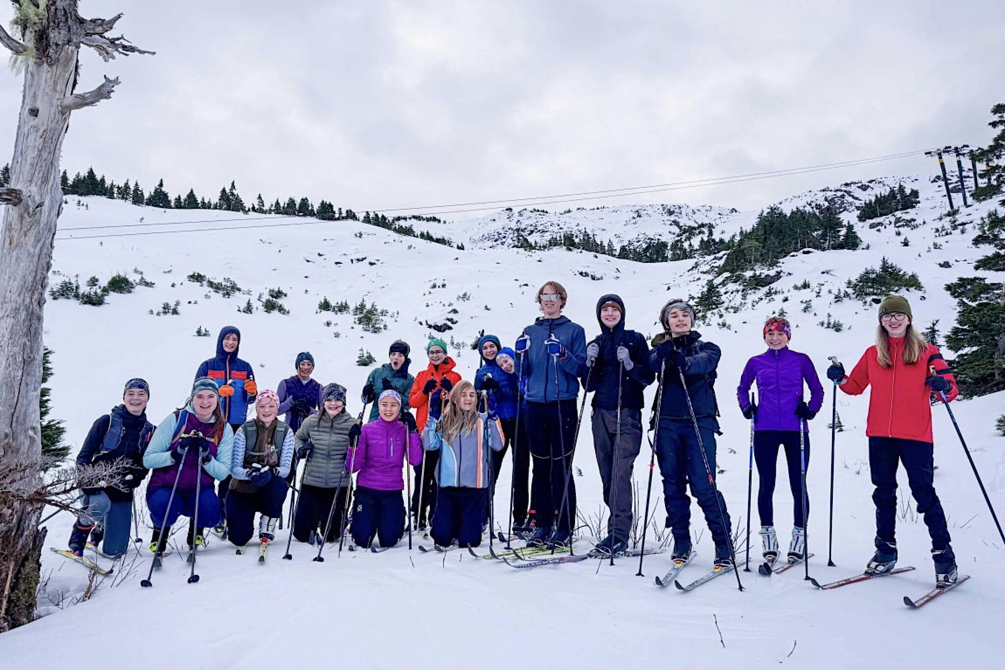 Members of the Juneau-Douglas High School: Yadaa.at Kalé Crimson Bears Nordic Ski Team pose for a photo at Eaglecrest Ski Area during a recent practice. (Photo courtesy Tristan Knutson-Lombardo)