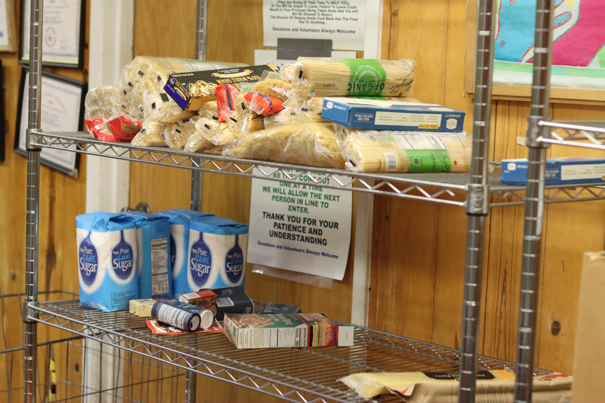 Sparse supplies are seen on shelves at the Helping Hands Food Bank during its final days operation in November of 2022, when it was forced to close after 39 years. Other food banks throughout Juneau today are seeing high demand due in part to rising food costs. (Jonson Kuhn / Juneau Empire file photo)