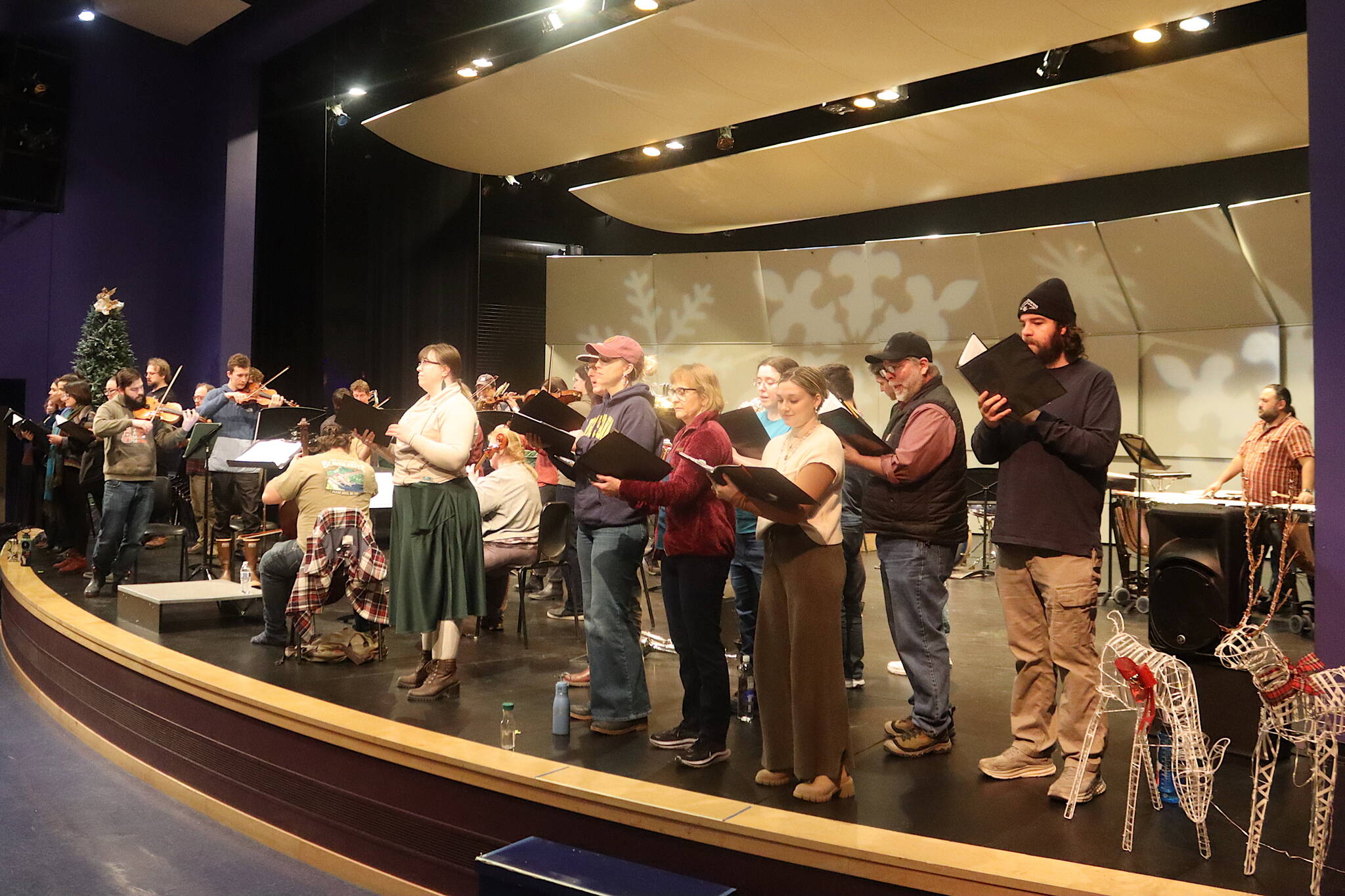 Members of the Juneau Symphony, Vox Borealis and Sitka Holiday Brass rehearse for an annual Holiday Cheer concert Friday at Thunder Mountain Middle School. (Mark Sabbatini / Juneau Empire)