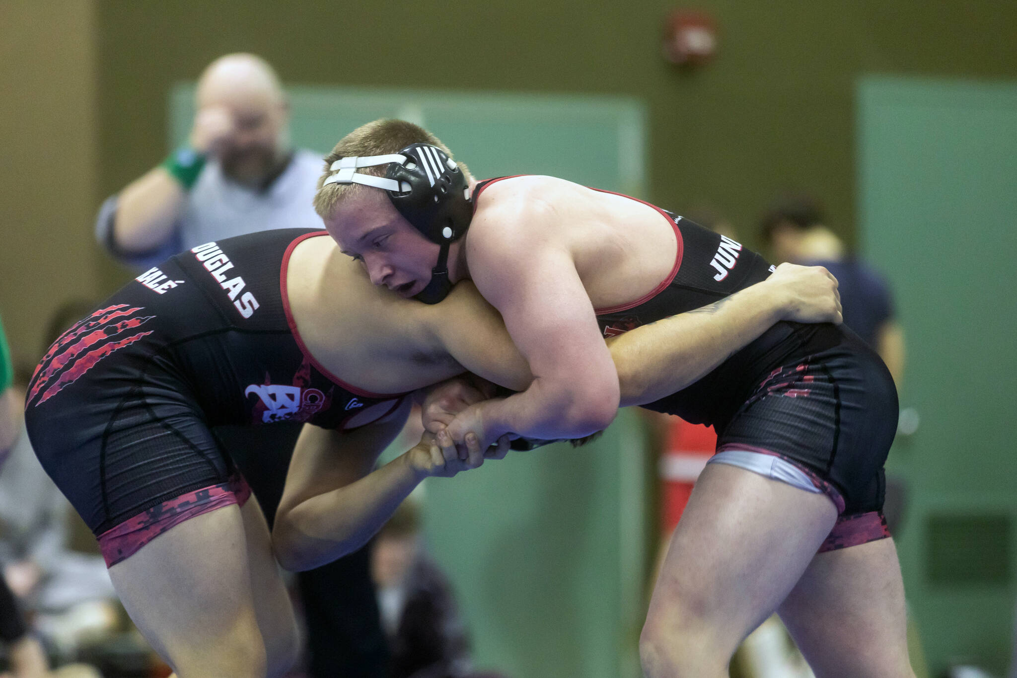 Hayden Aube and Ivan Shockley go head to head on Friday, Dec. 13, 2024, during the Region V wrestling tournament in Haines. Eleven Crimson Bears earned individual titles, 12 placed second meaning that 23 are headed to state in Anchorage next weekend. (Rashah McChesney/Chilkat Valley News)