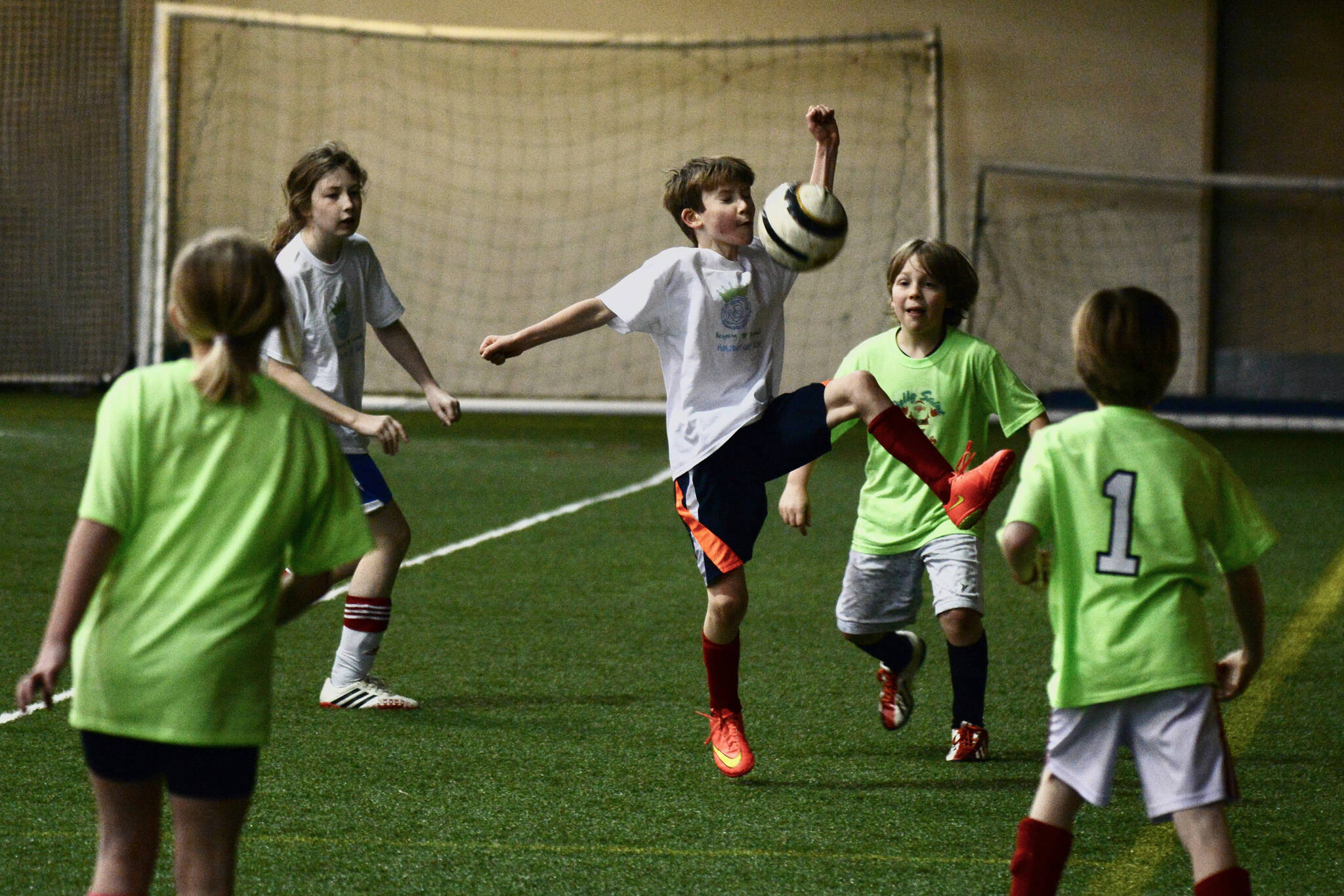 The Holiday Cup has been a community favorite event for years. This 2014 photo shows the Jolly Saint Kicks and Reigning Snowballs players in action. (Klas Stolpe / Juneau Empire)