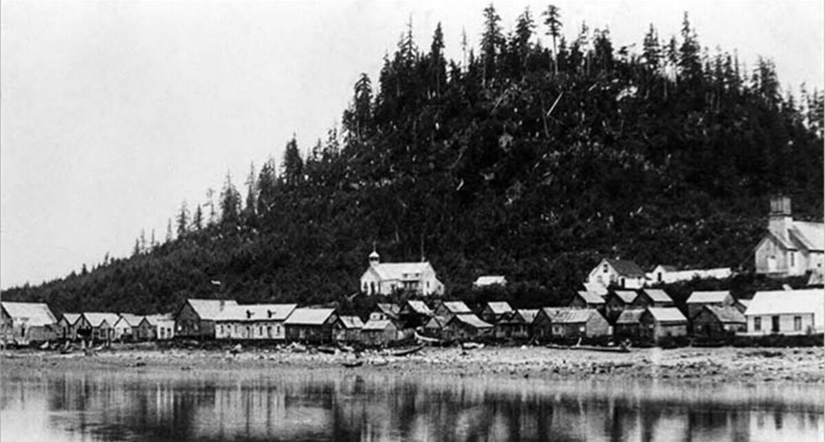 The Wrangell shoreline with about two dozen buildings visible, including a Russian Orthodox church, before the U.S. Army bombardment in 1869. (Alaska State Library, U.S. Army Infantry Brigade photo collection)