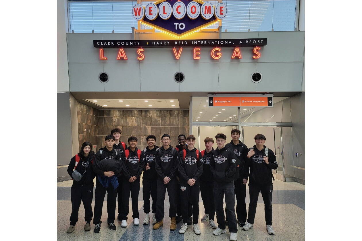 The Juneau-Douglas High School: Yadaa.at Kalé Crimson Bears boys basketball team pose upon their arrival in Las Vegas for the Tarkanian Classic Tournament. (Photo courtesy JDHS Crimson Bears)1