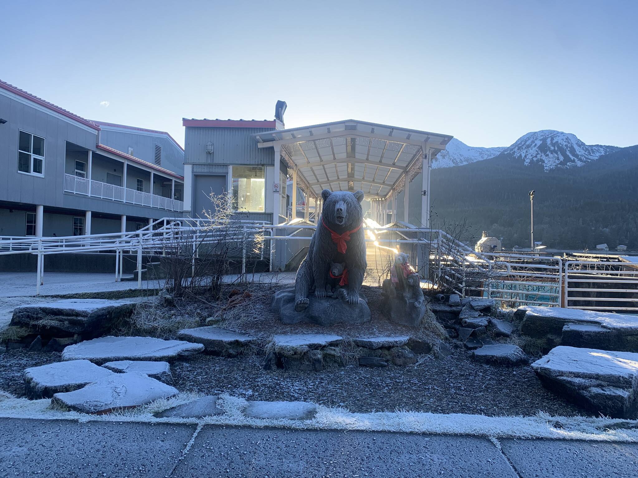 A bear family sculpture decorated for the holidays awaits visitors at the entrance of the DIPAC Macaulay Salmon Hatchery on Monday. (Mark Sabbatini / Juneau Empire)