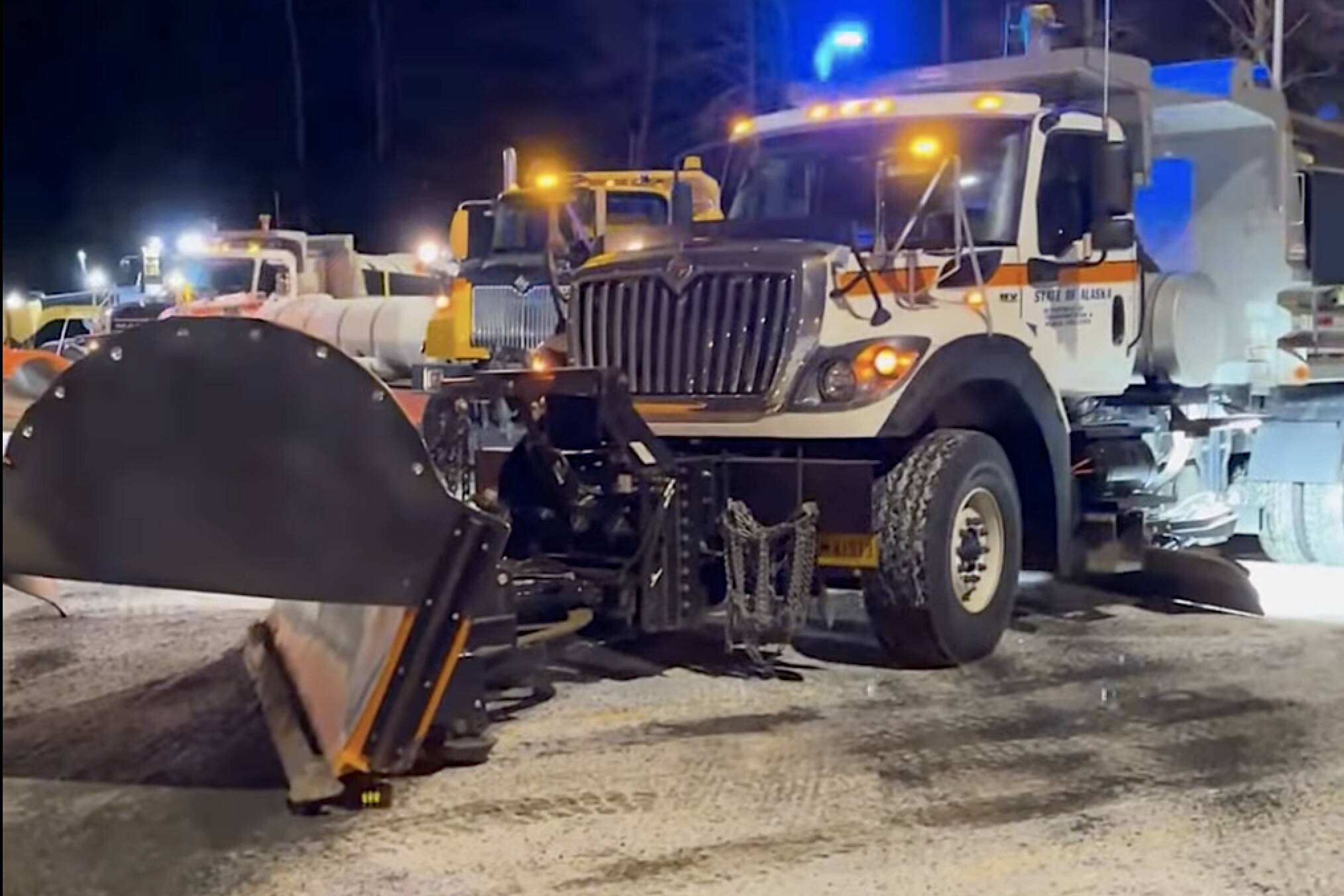 The newly named Ka-PLOW is seen with other Alaska Department of Transportation and Public Facilities equipment in Juneau in a video announcing the names of three local snowplows in a contest featuring more than 400 entries. (Screenshot from Alaska Department of Transportation and Public Facilities video)