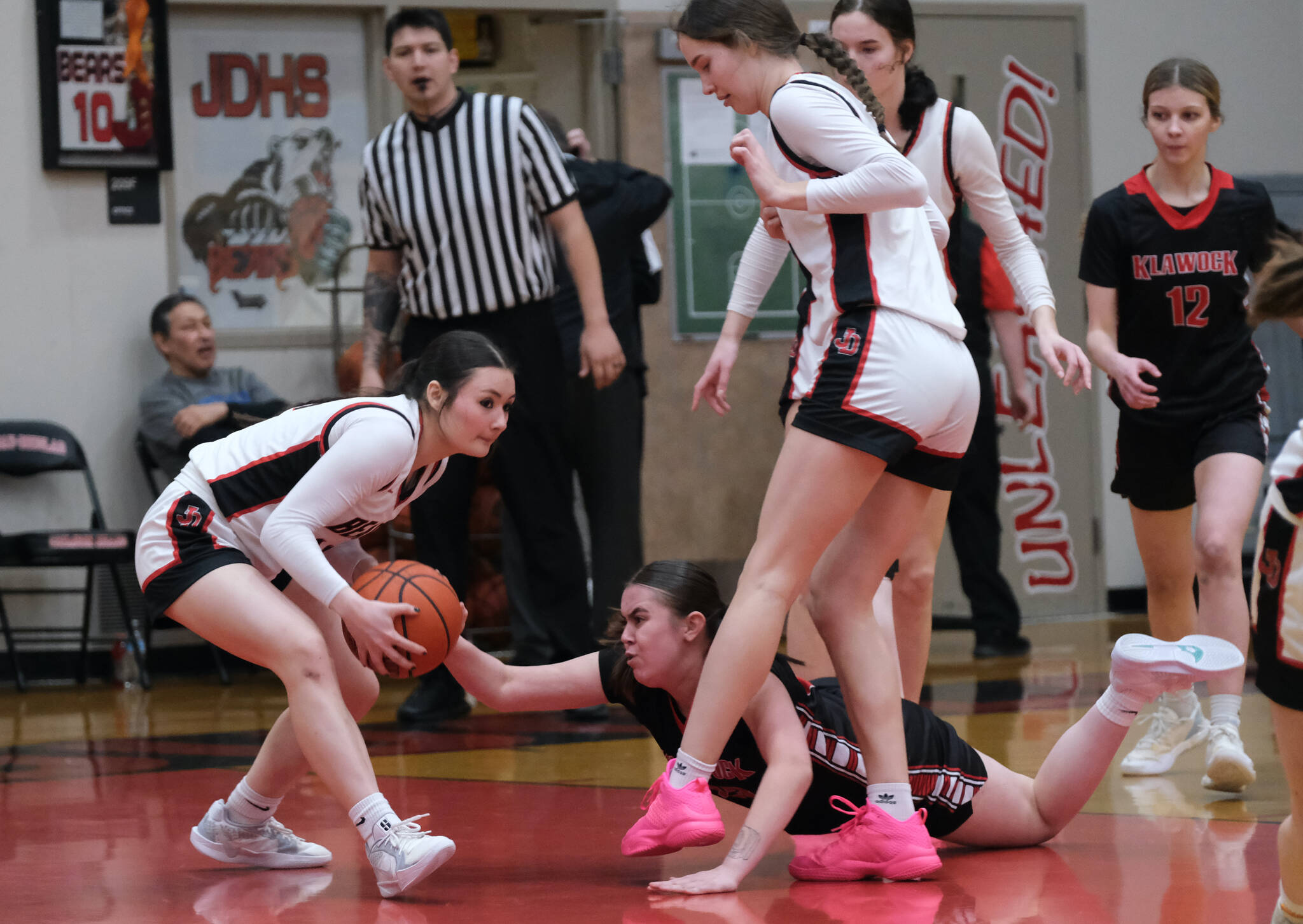 Juneau-Douglas High School: Yadaa.at Kalé Crimson Bears sophomore Layla Tokuoka takes the ball from Klawock senior Lea Armour during the Crimson Bears 71-21 win over the Chieftains on the opening day of the George Houston Capital City Classic on Friday in Juneau. (Klas Stolpe / Juneau Empire)