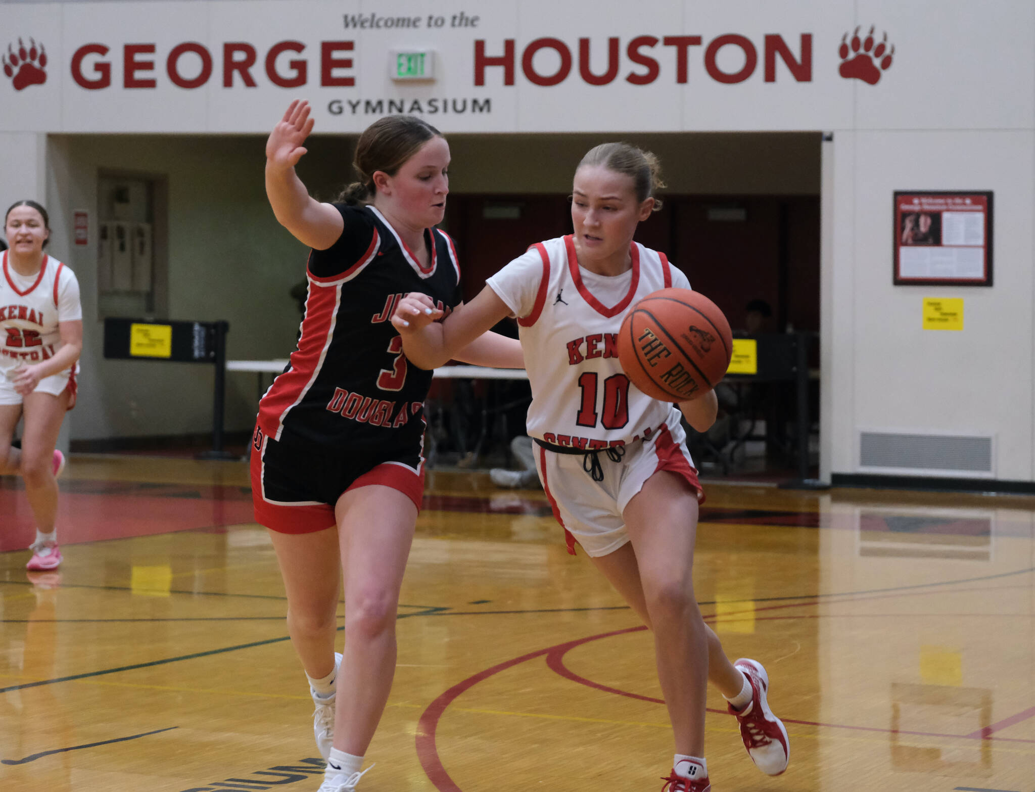 Juneau-Douglas High School: Yadaa.at Kalé junior Cambry Lockhart (3) pressures Kenai sophomore Gracee Every (10) in the Crimson Bears 57-13 win over the Cardinals during Saturday action at the George Houston Capital City Classic in Juneau. (Klas Stolpe / Juneau Empire)