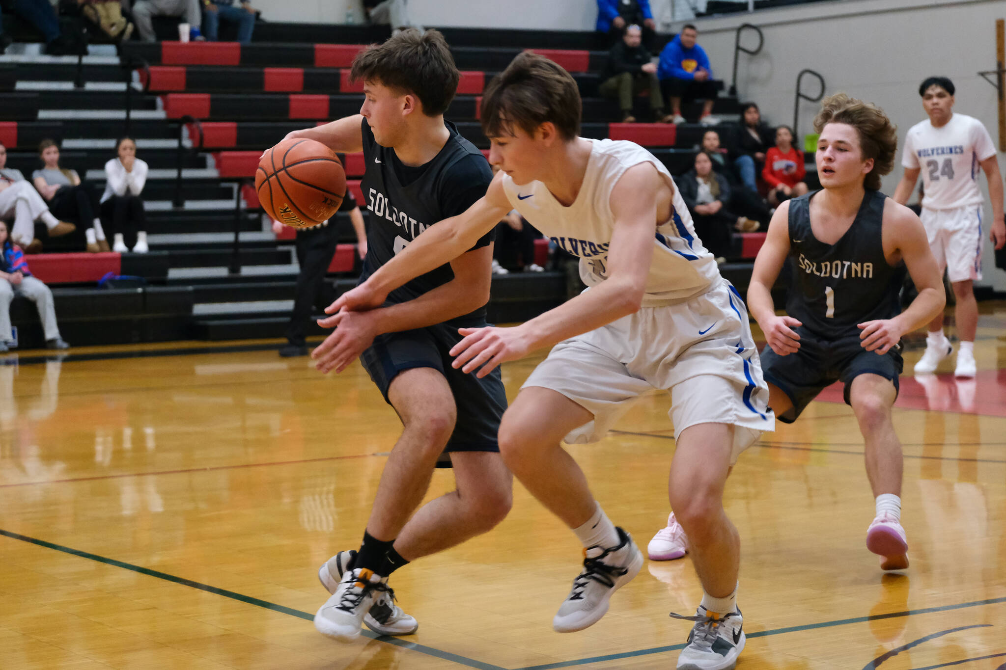 Soldotna senior Easton Hawkins spins away from Cordova senior Thomas Nothstine during the Stars 56-52 overtime win over the Wolverines during Sunday action at the George Houston Capital City Classic in Juneau. (Klas Stolpe / Juneau Empire)