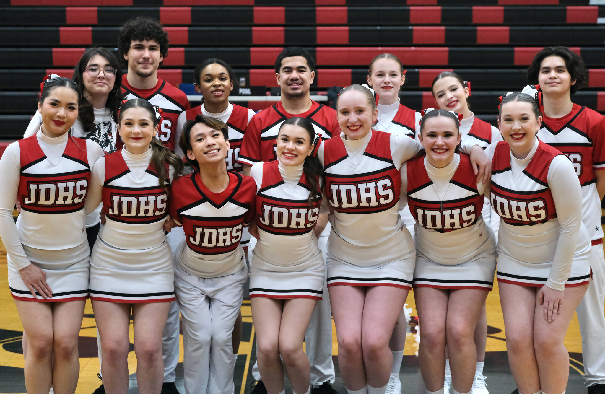 The Juneau-Douglas High School: Yadaa.at Kalé Basketball Cheer Team. Back Row (left-right) are Sophia Percy, Stefano Rivera, Marlee Gines, Mati Iona, Hadley Bex, Alexa Scarano and Renz Hill. Front row (left to right) are Audrey Yu, Karina San Miguel, Aidan Lazo, Mia Brown Cortez, Megan Pierce, Ayla Keller and Gabby Ely. (Klas Stolpe / Juneau Empire)