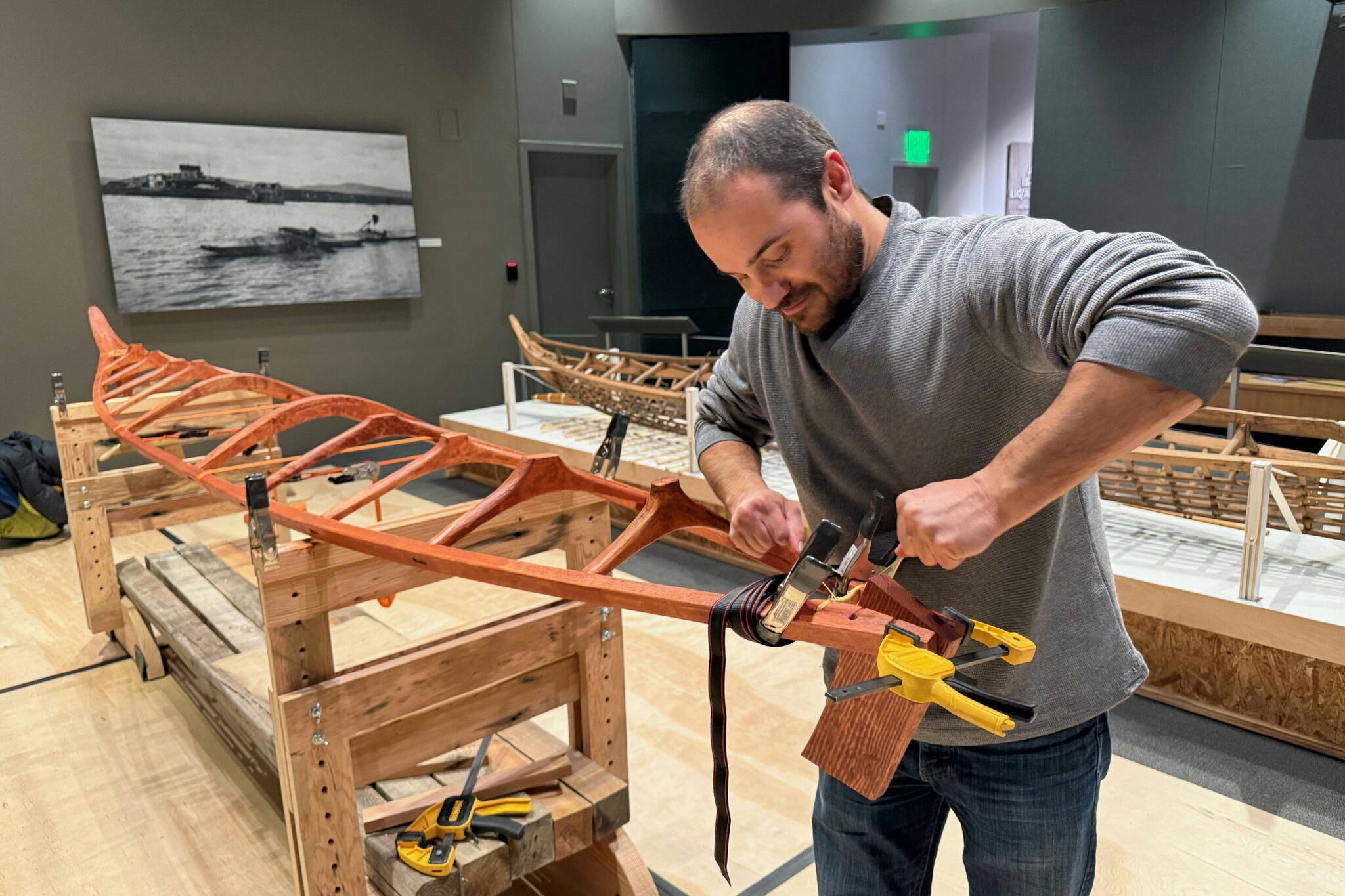 Juneau-based qayaq (kayak) maker Lou Logan works on his exhibit that will be at the Alaska State Museum during First Friday in January. (Photo provided by the Juneau Arts and Humanities Council)