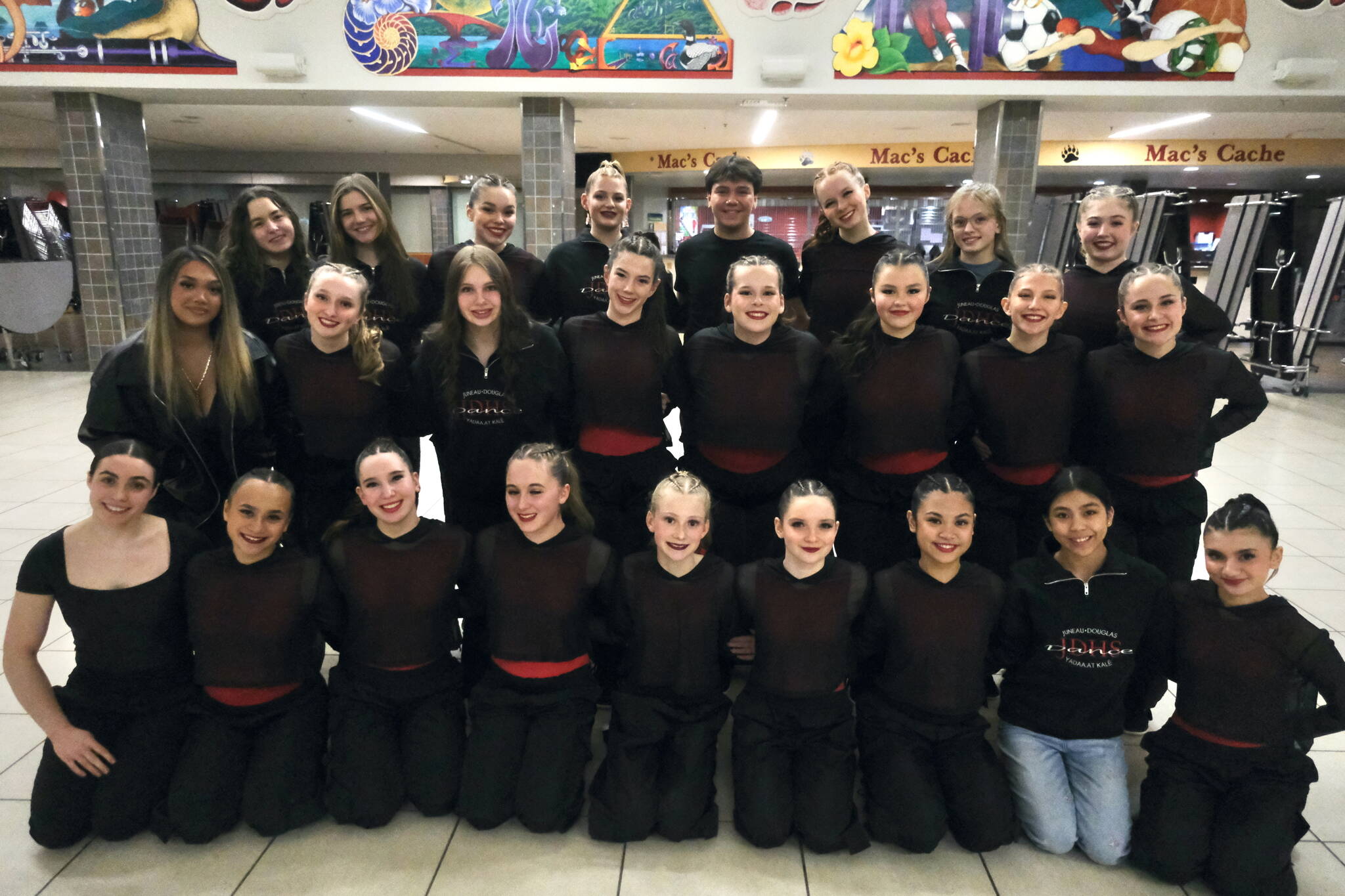 The Juneau-Douglas High School: Yadaa.at Kalé Dance Team pose for a photo in the JDHS commons before Saturday’s Crimson Bears basketball game against Ketchikan. (Klas Stolpe / Juneau Empire)