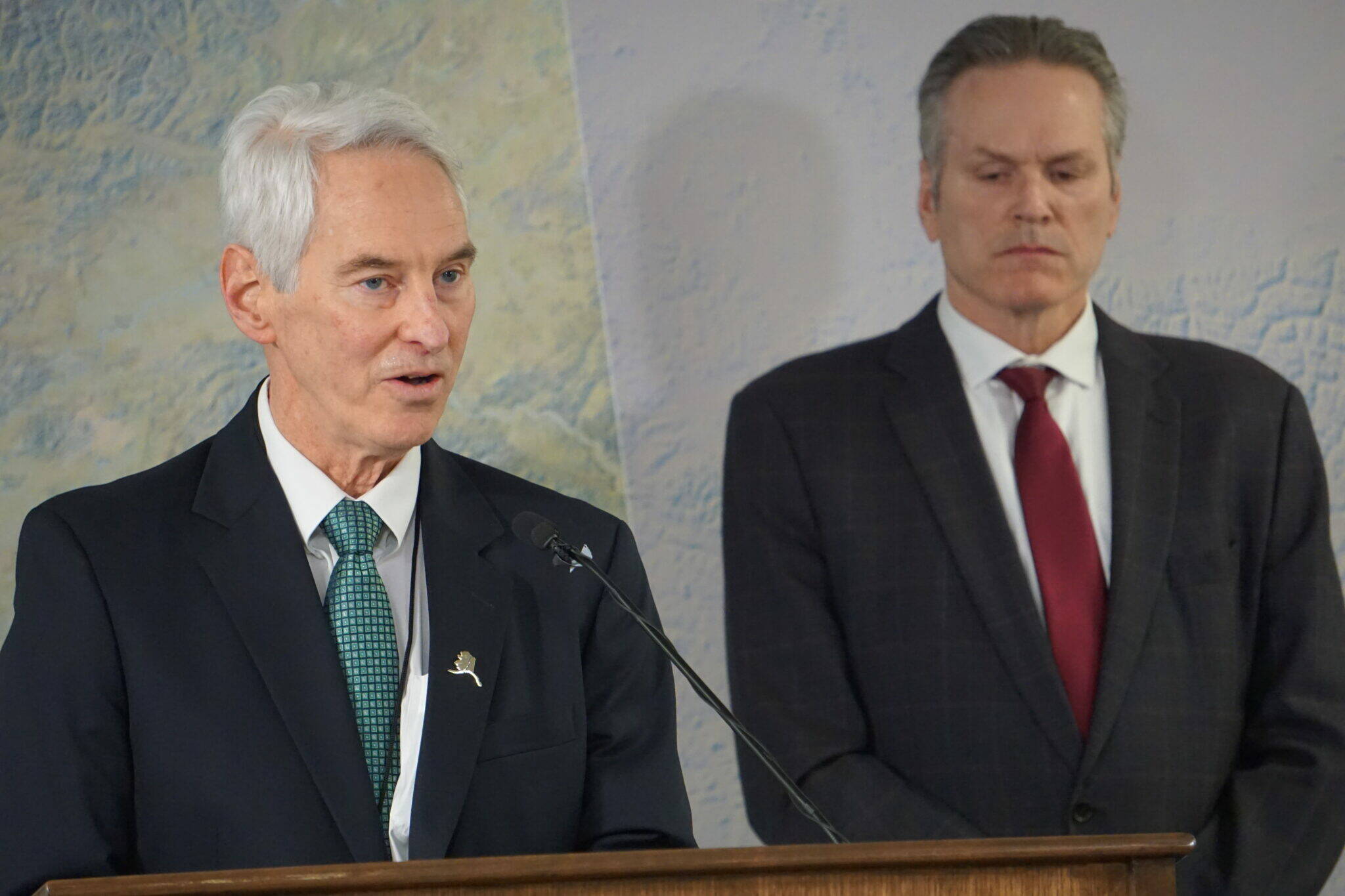 Frank Richards, president of the Alaska Gasline Development Corp., speaks at a Jan. 6, 2025, news conference held in Anchorage by Gov. Mike Dunleavy. Dunleavy is standing behind him. (Yereth Rosen/Alaska Beacon)