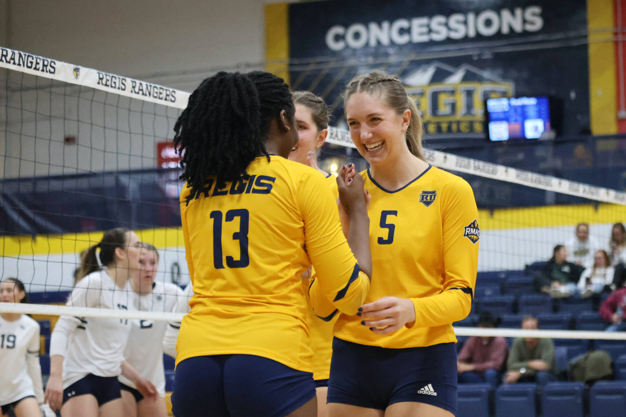 2022 Juneau-Douglas High School: Yadaa.at Kalé graduate Brooke Sanford (5) reacts with teammates during a Regis University Rangers home volleyball match this season in Denver, Colorado. (Regis photo courtesy Makayla Salter)