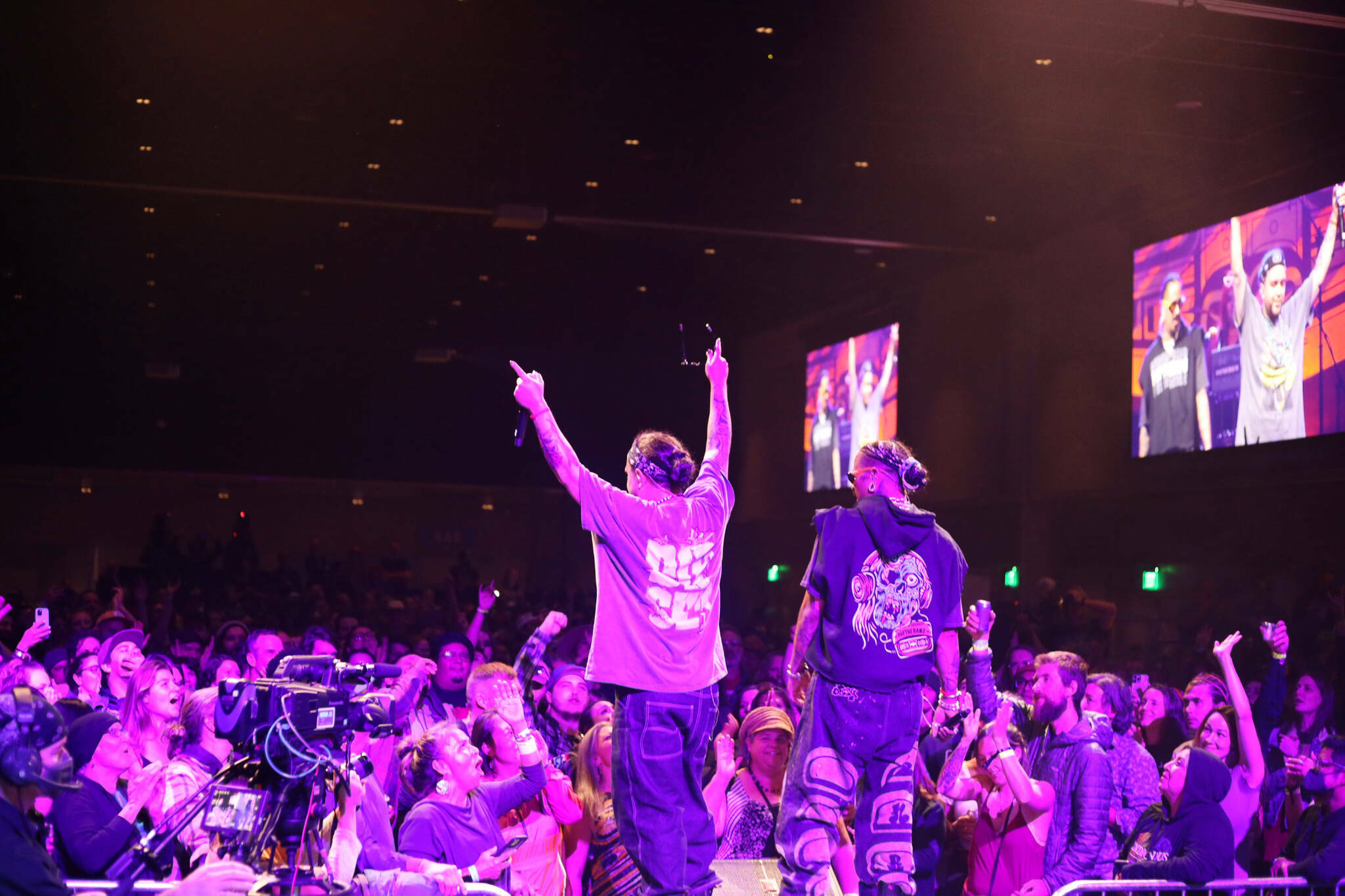 Snotty Nose Rez Kids rappers Yung Trybez and Young D sing to the crowd during a performance as part of the final night of the Áak’w Rock music festival at Centennial Hall on Saturday, Sept. 23, 2023. (Clarise Larson / Juneau Empire file photo)