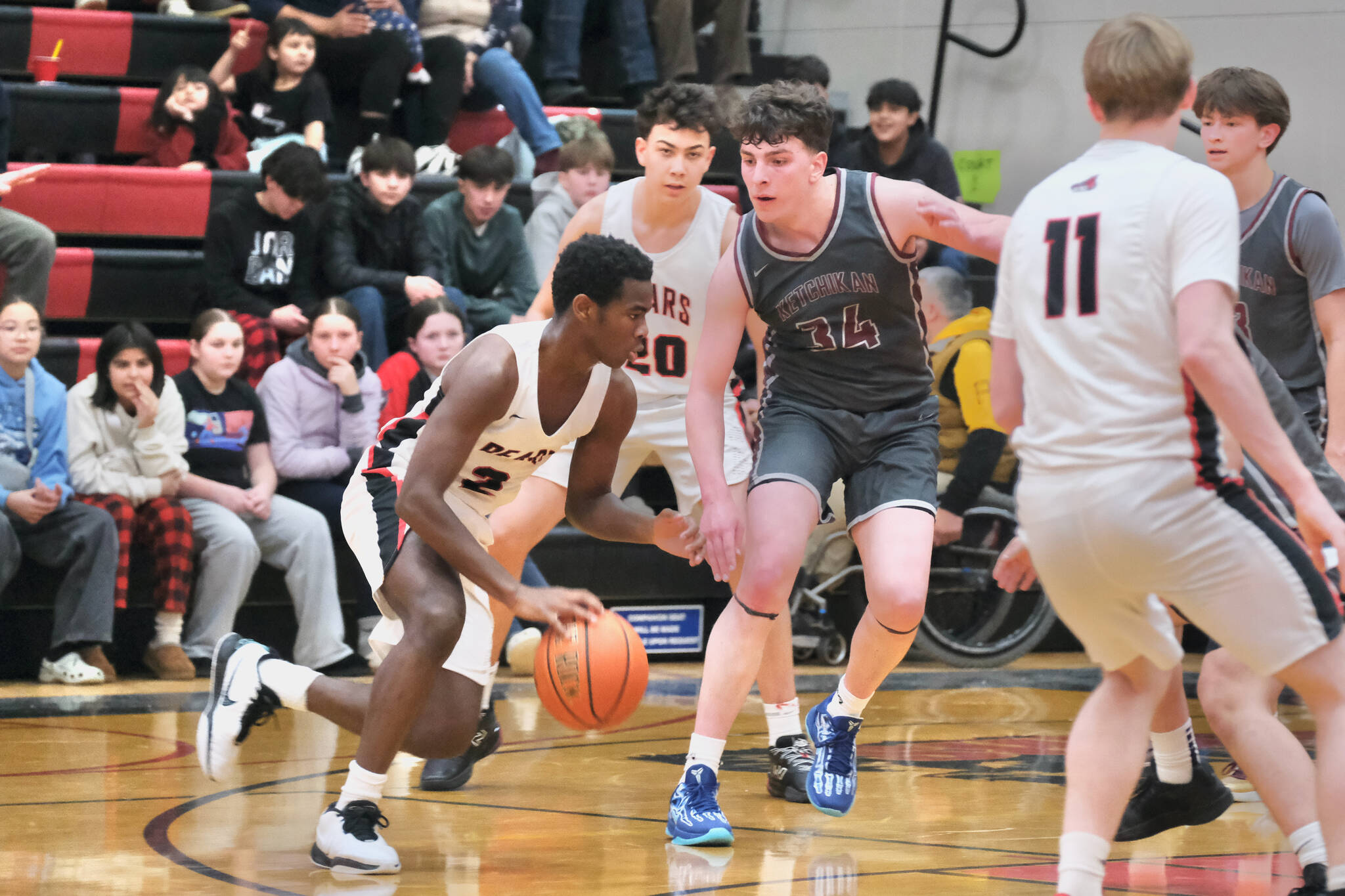 Juneau-Douglas High School: Yadaa.at Kalé senior Ahmir Parker (2), junior Elias Dybdahl (20) and senior Ben Sikes (11) in action last week against Ketchikan. The three Crimson Bears played key roles in JDHS’ 64-49 win over Soldotna on Thursday in the Palmer Elks Showdown tournament at Palmer. The Crimson Bears continue play on Friday and Saturday. (Klas Stolpe / Juneau Empire file photo)