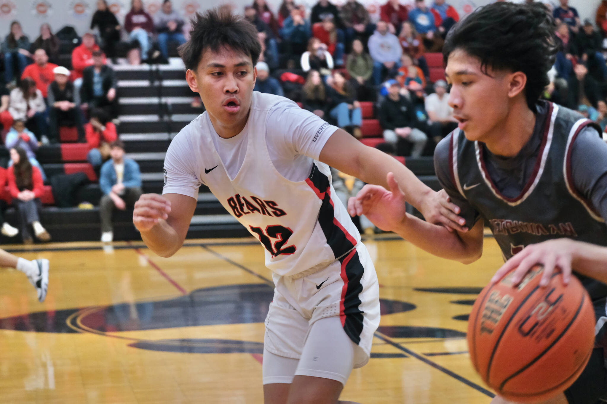 Juneau-Douglas High School: Yadaa.at Kalé junior Joren Gasga (12) guarding Ketchikan’s Edward Dela Cruz last weekend. Gasga was part of JDHS’ defensive pressure in Friday’s 71-46 win over Homer at the Palmer Elks Tournament in Palmer. (Klas Stolpe / Juneau Empire file photo)