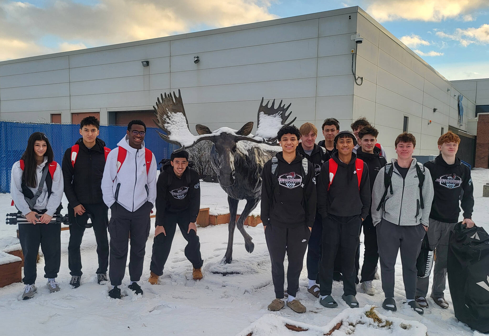 The Juneau-Douglas High School: Yadaa.at Kalé boys basketball team pose at the home of the Palmer Moose during the Palmer Elks Tournament at Palmer. (Photo courtesy JDHS)