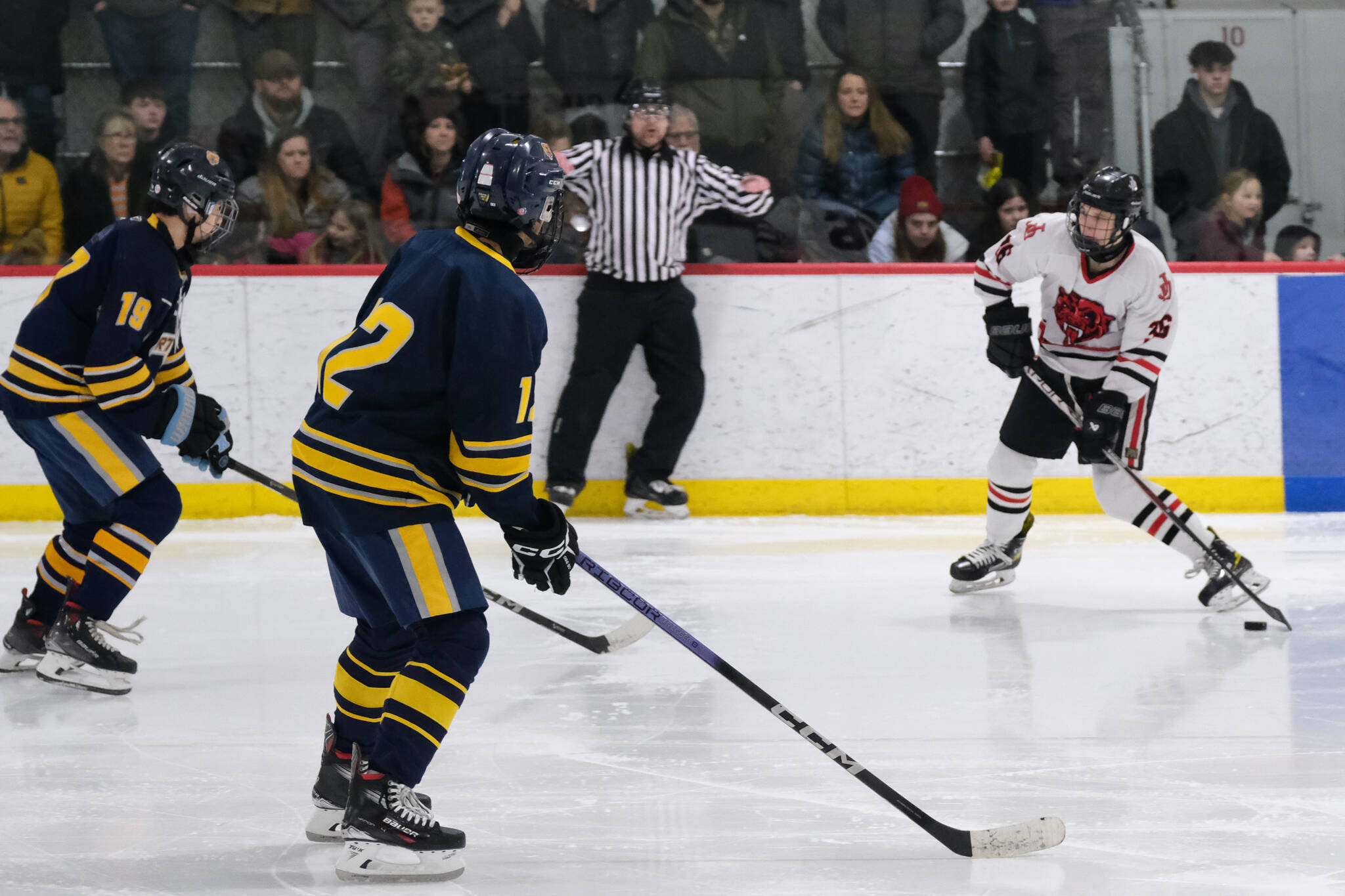 Juneau-Douglas High School: Yadaa.at Kalé junior Elliot Welch (36) taking a shot against Bartlett senior Dylan Beals (19) and junior Phillip Deguzman (12) in a Crimson Bears win earlier this season at Juneau’s Treadwell Ice Arena. Welch scored three goals Friday and two Saturday at Homer. (Klas Stolpe / Juneau Empire file photo)