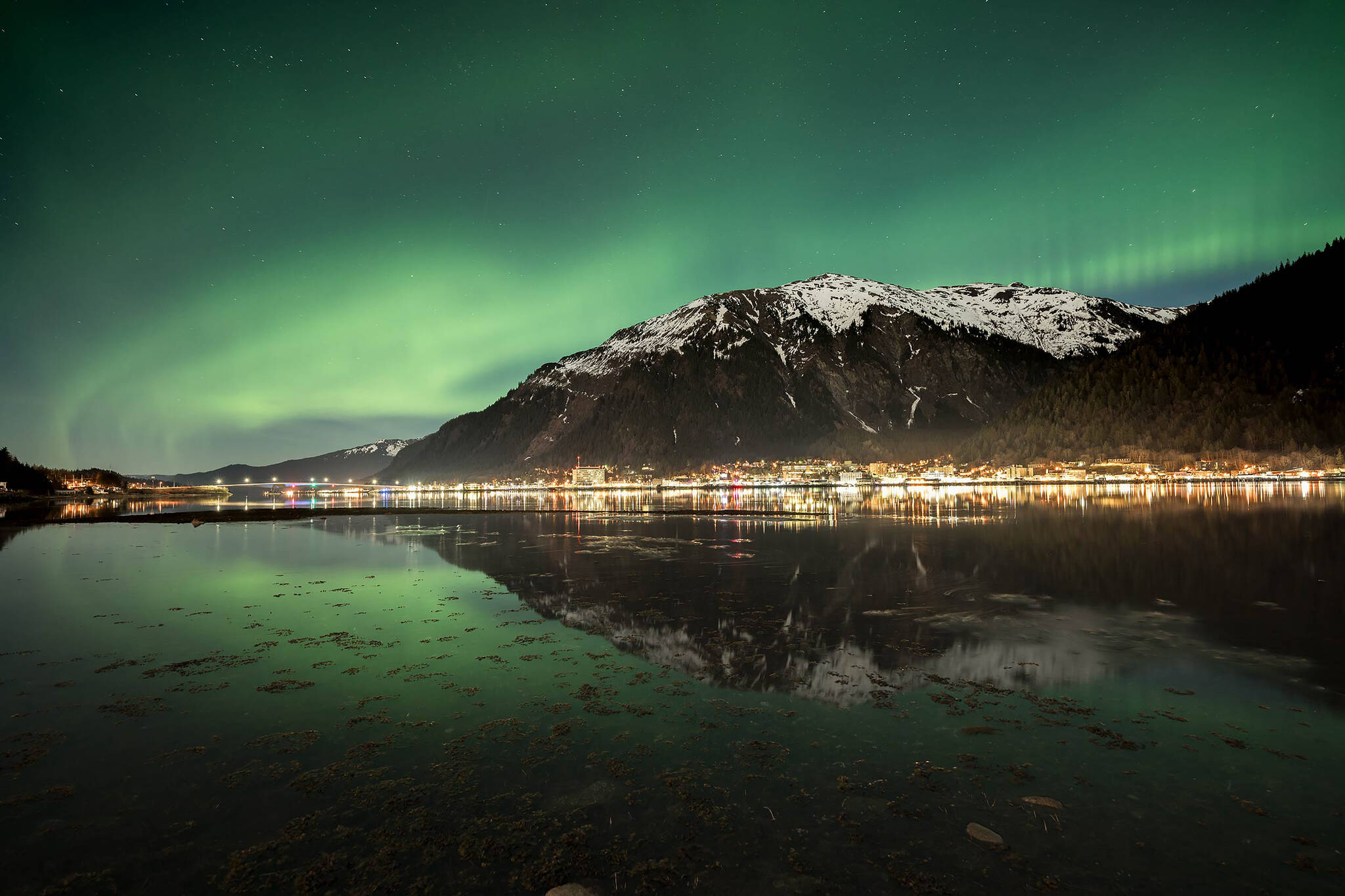 In an undated image provided by Chris Miller, an image of the northern lights in Juneau shows what a camera with a longer exposure captures. As astrotourism booms, the northern lights get a boost from digital photography. (Chris Miller via The New York Times)