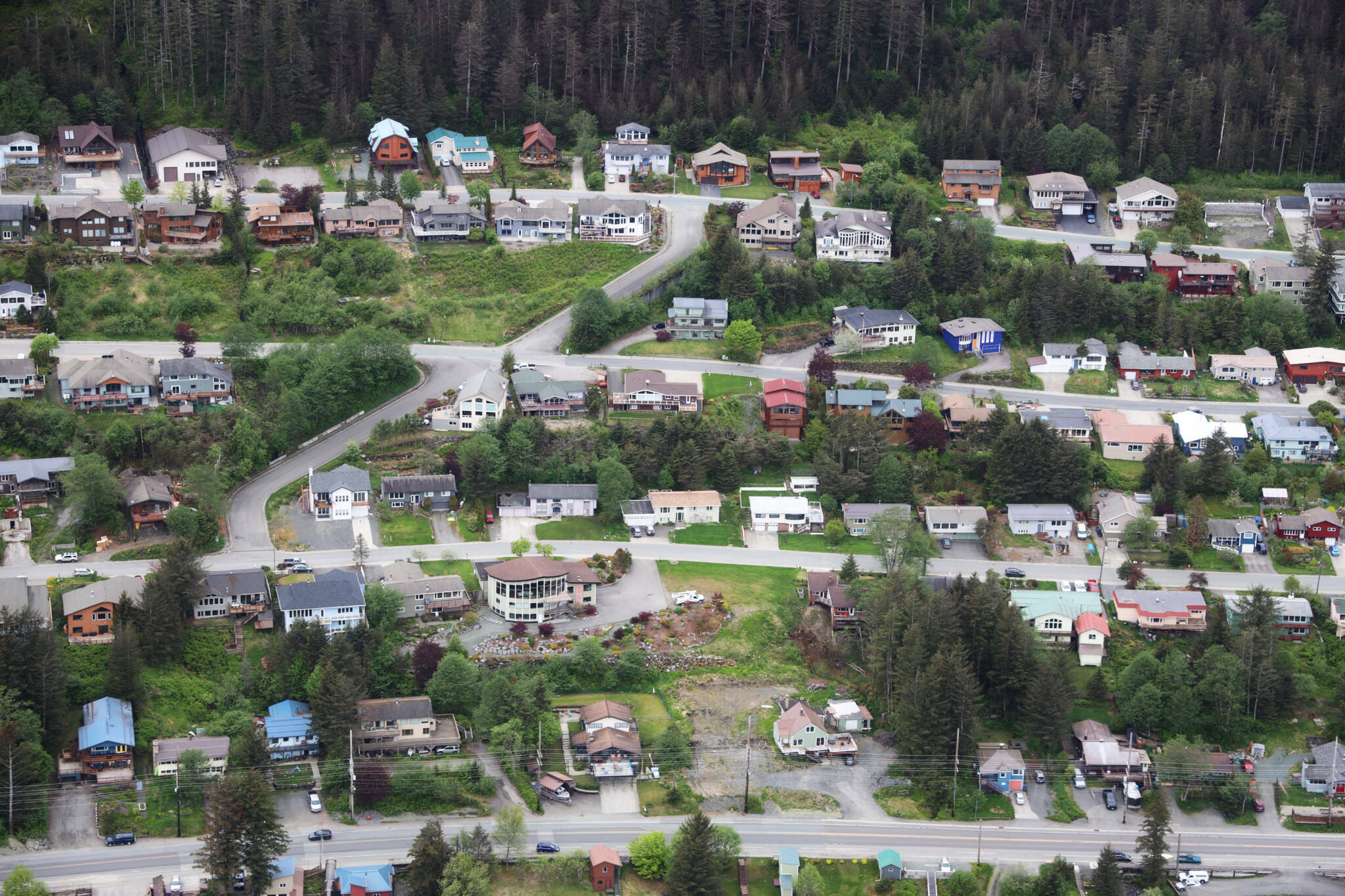 Rows of houses line Douglas Highway in late May of 2023. (Clarise Larson / Juneau Empire file photo)