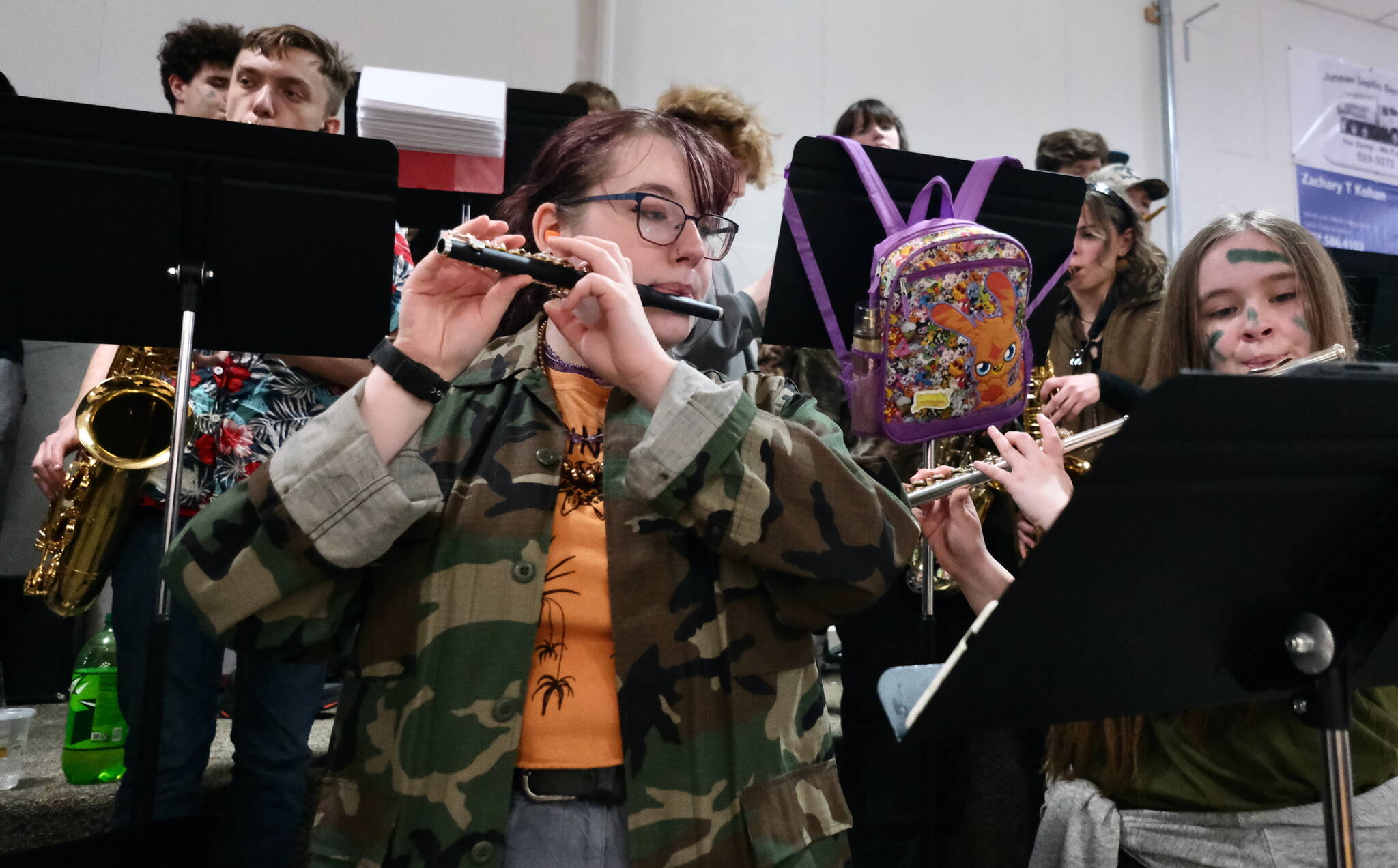 Members of the Juneau-Douglas High School: Yadaa.at Kalé Crimson Bears pep band perform during a home game at the George Houston Gymnasium earlier this season. (Klas Stolpe / Juneau Empire)