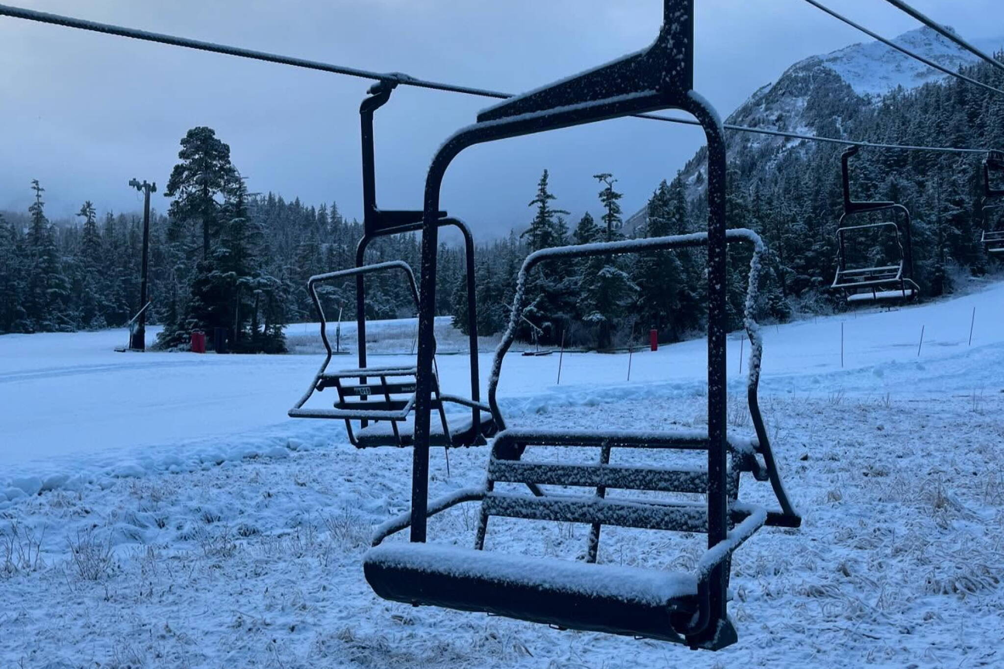 A dusting of snow covers the Ptarmigan chairlift at Eaglecrest Ski Area in December. The lift to the top of the mountain remains closed as of Friday due to a lack of snow. (Eaglecrest Ski Area photo)