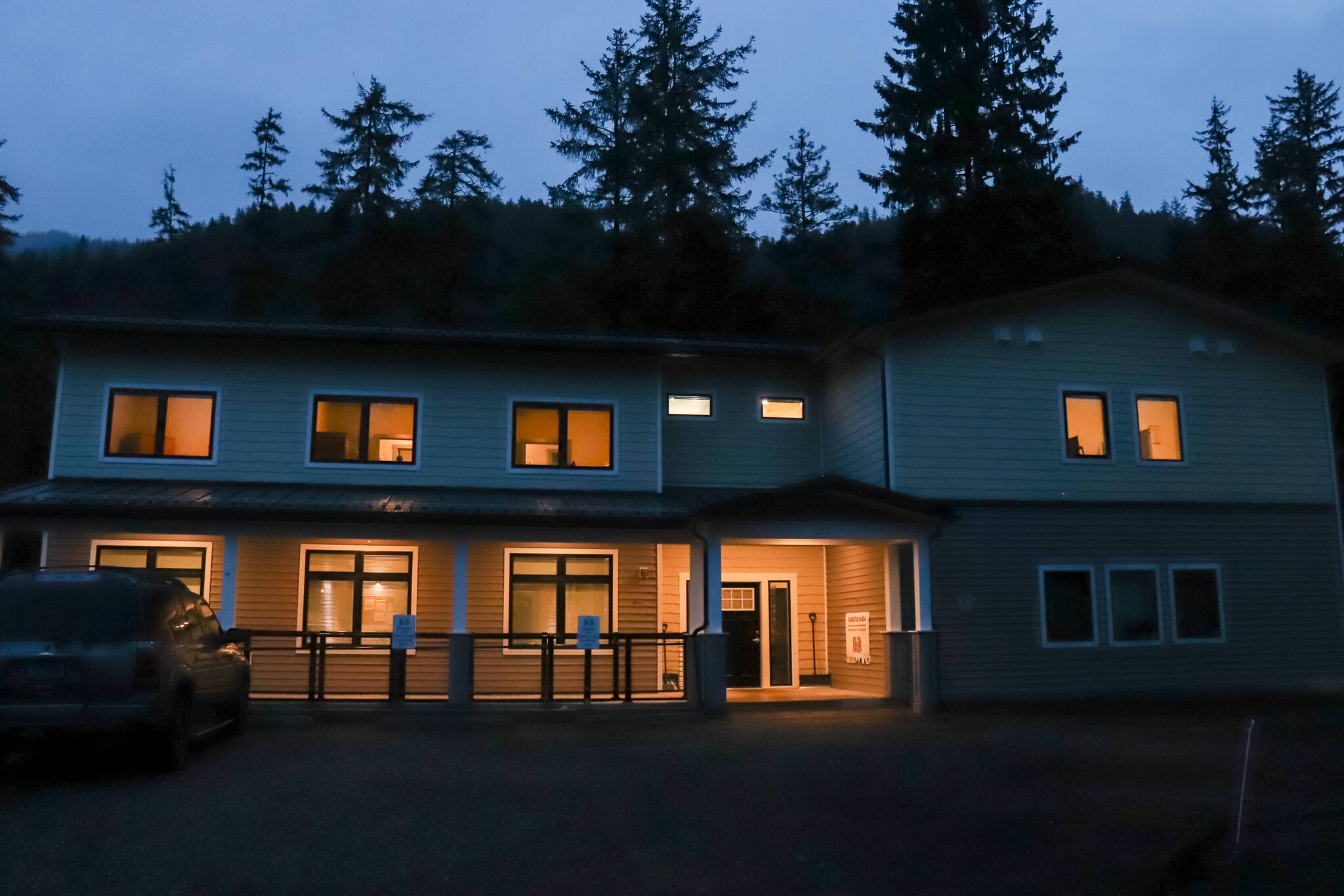 Haven House, Tlingit and Haida’s third shelter under their Reentry and Recovery Program, is seen with lights on in the dark. (Jasz Garrett / Juneau Empire)