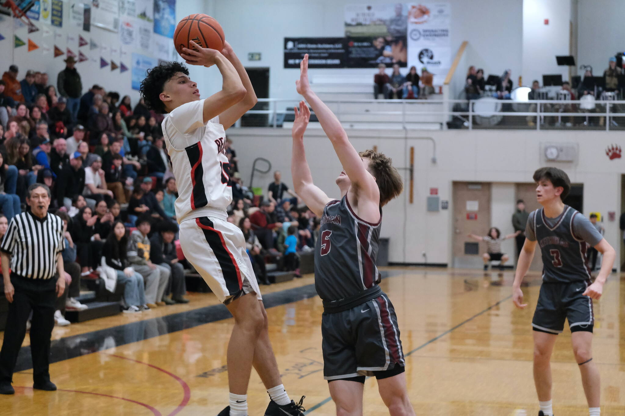 Juneau-Douglas High School: Yadaa.at Kalé senior Pedrin Saceda-Hurt scores against Ketchikan earlier this season in the George Houston Gymnasium. The Crimson Bears fell to Monroe on Friday 84-71 in the Colony Basketball Classic at Palmer. (Klas Stolpe / Juneau Empire file photo)